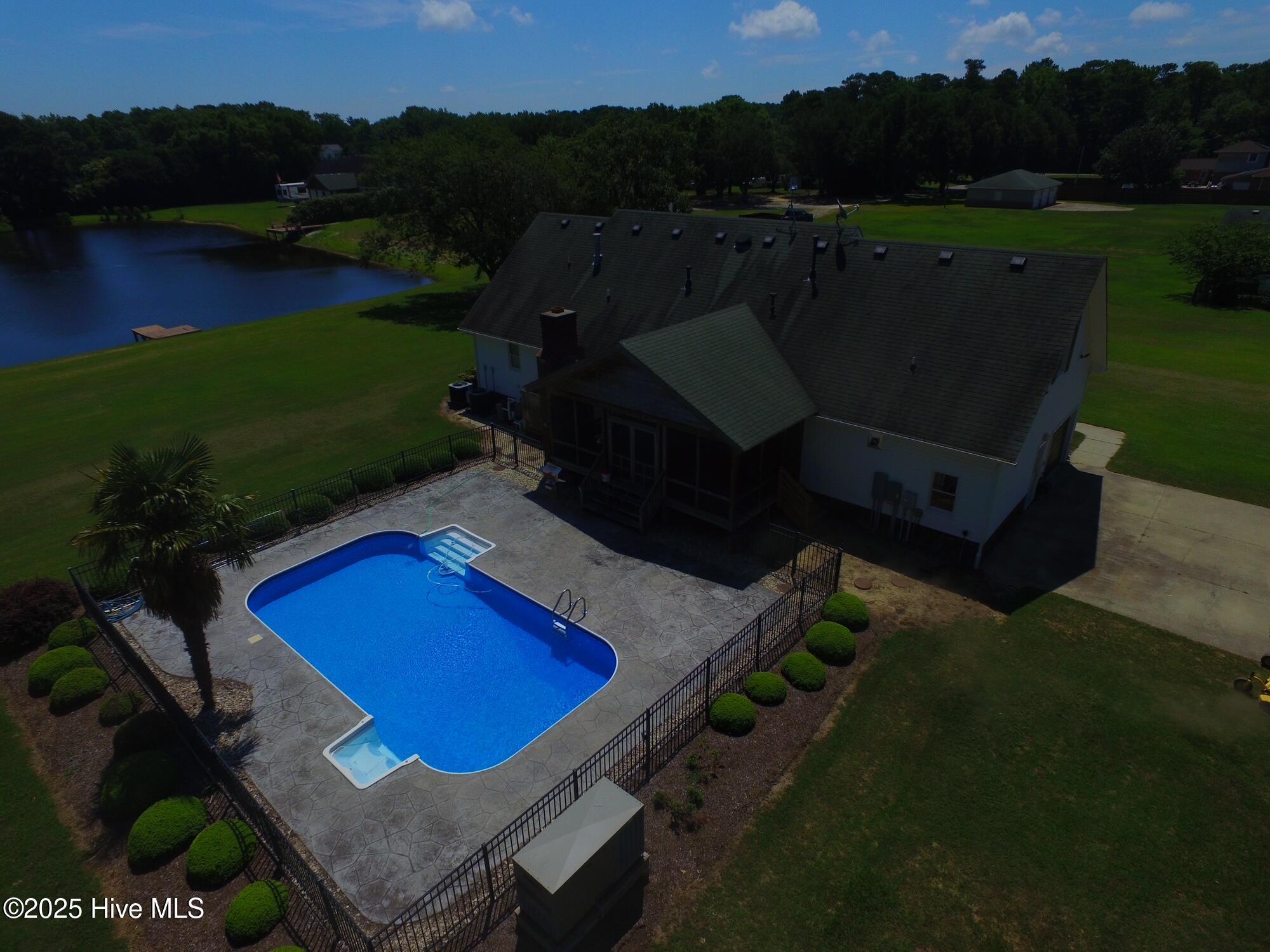 Image 2: 104 Perry's Way droneshot of house and p