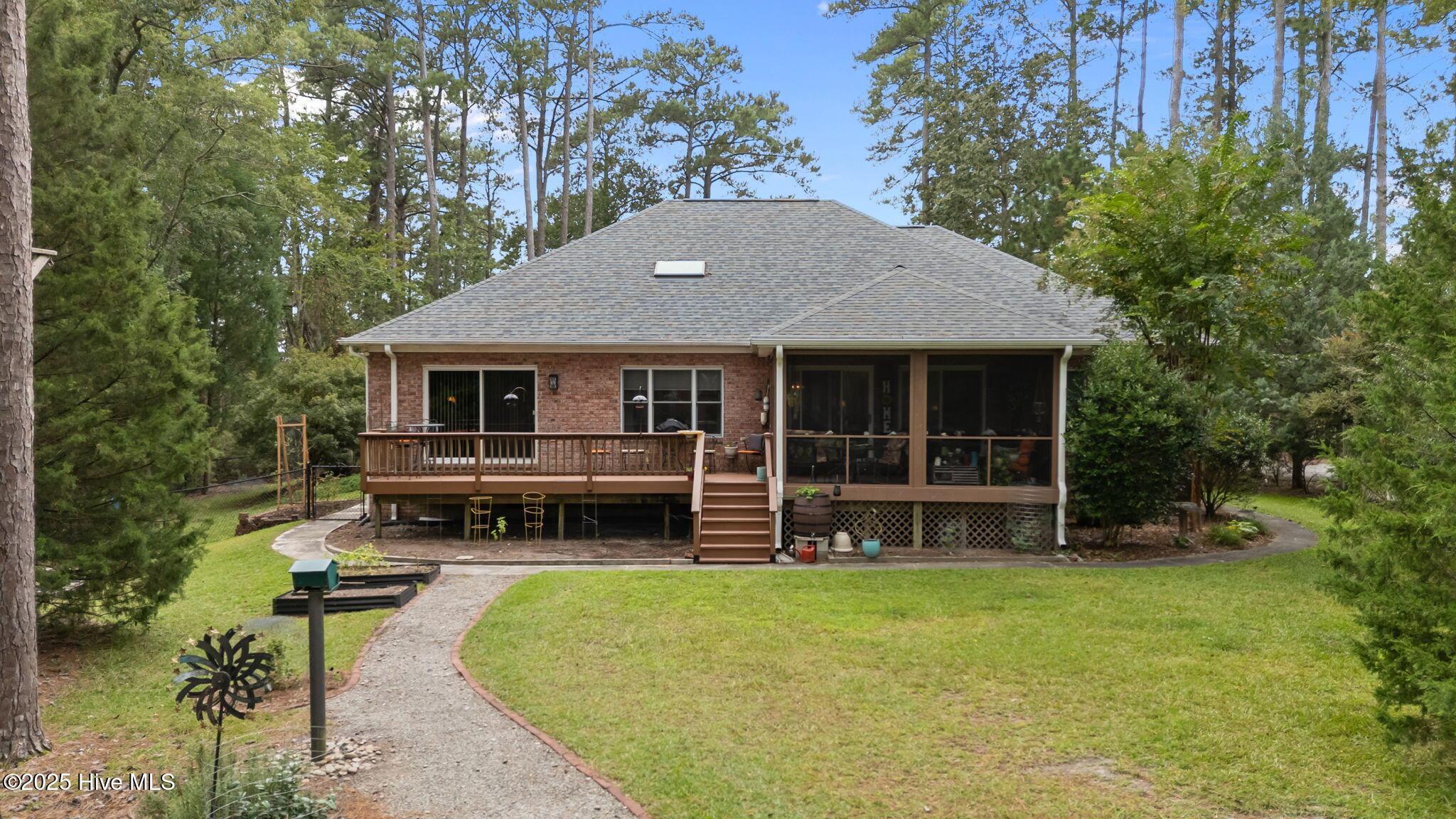Image 4: Looking into screen porch and rear deck