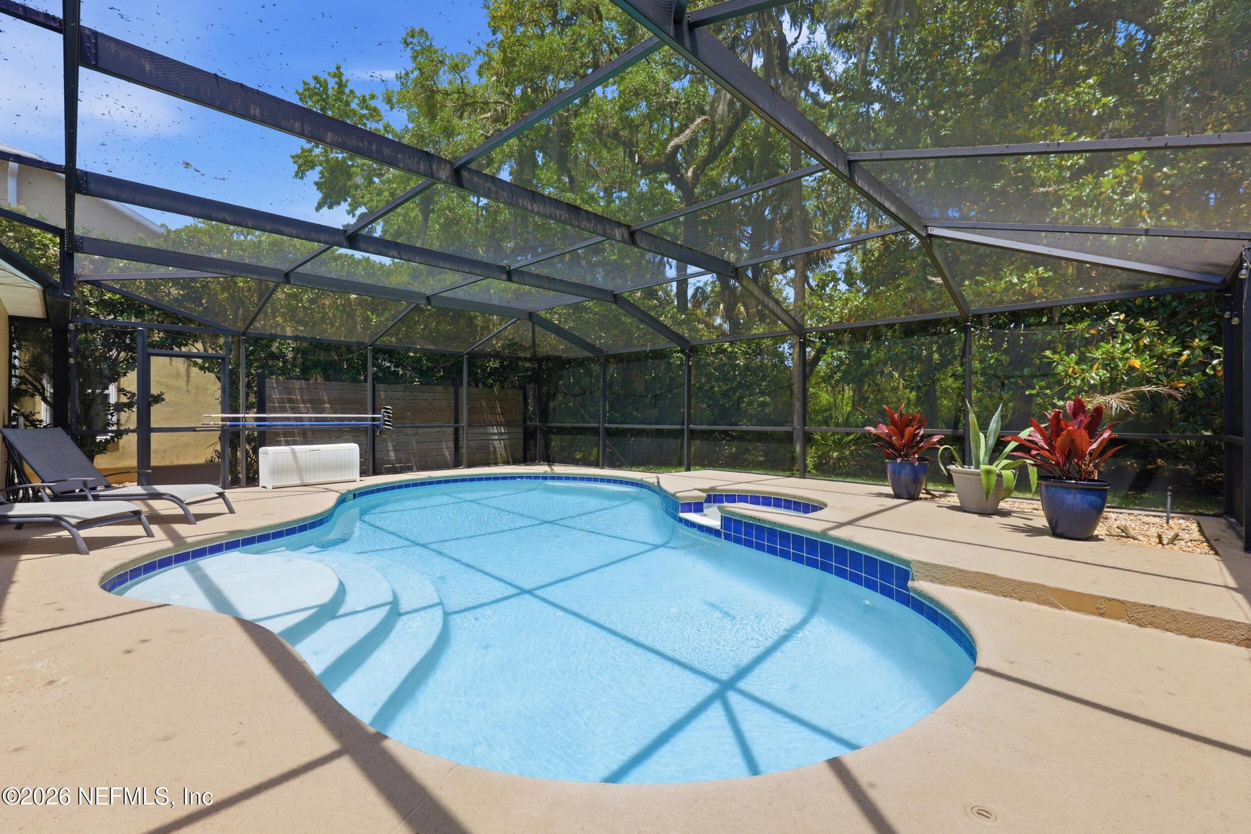 Image 4: Screened and heated pool