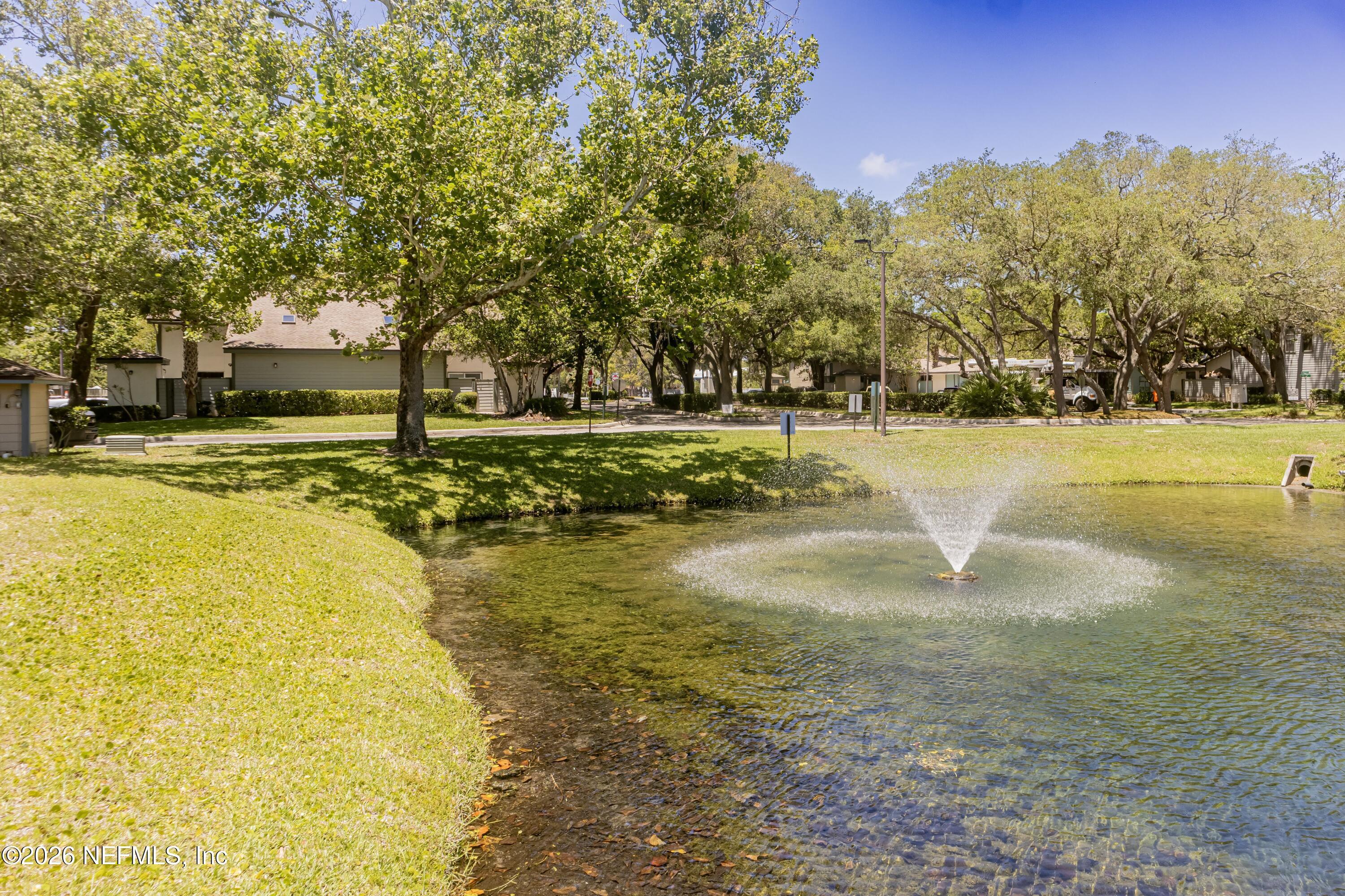 Image 2: 1403 defender ct tree canopy with pond