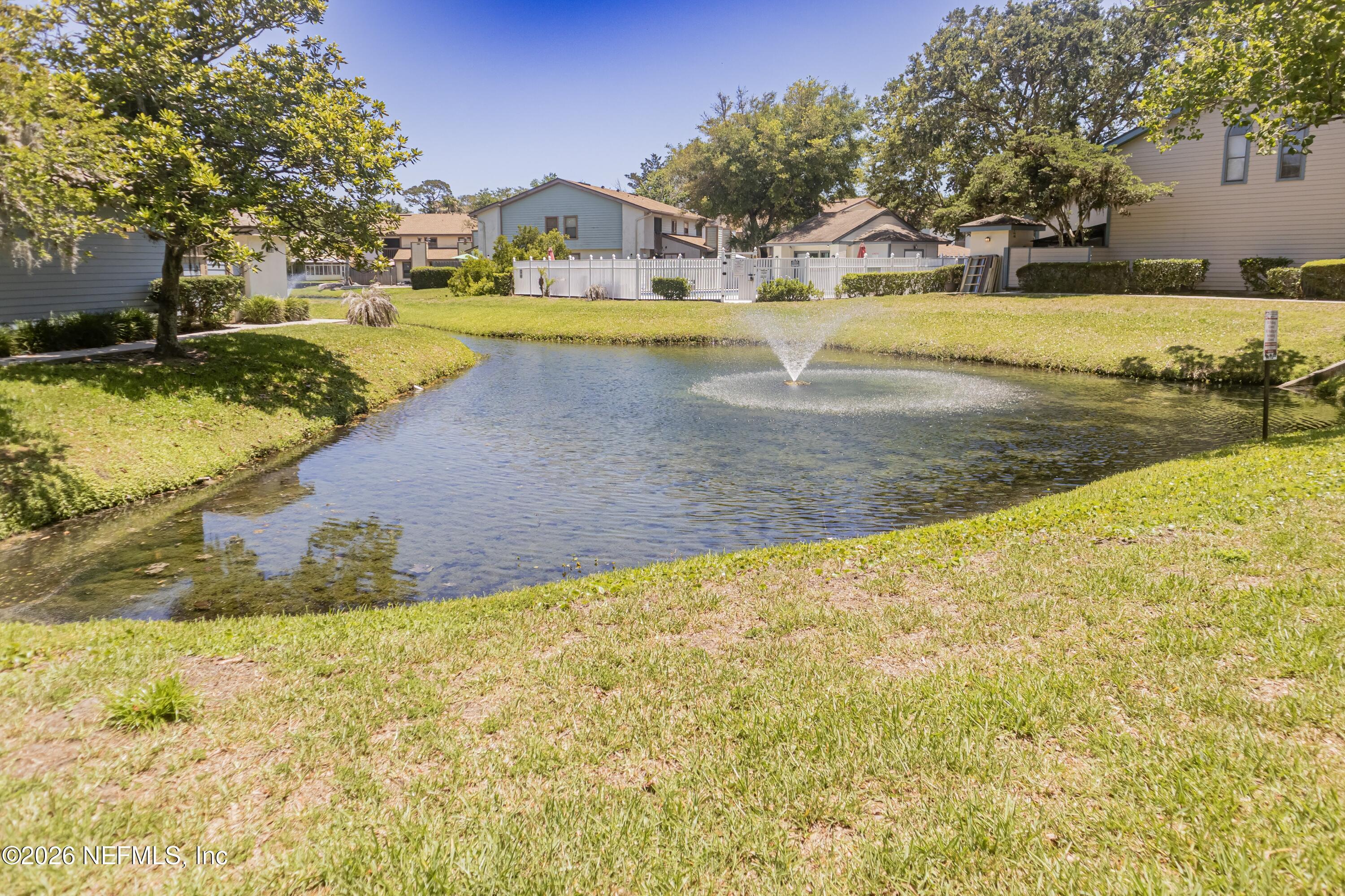 Image 3: 1403 Defender Ct Pond to buildings view