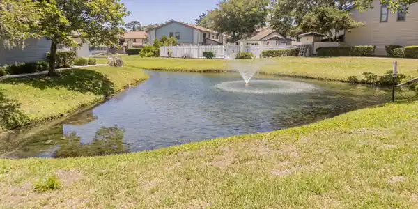 Image 3: 1403 Defender Ct Pond to buildings view