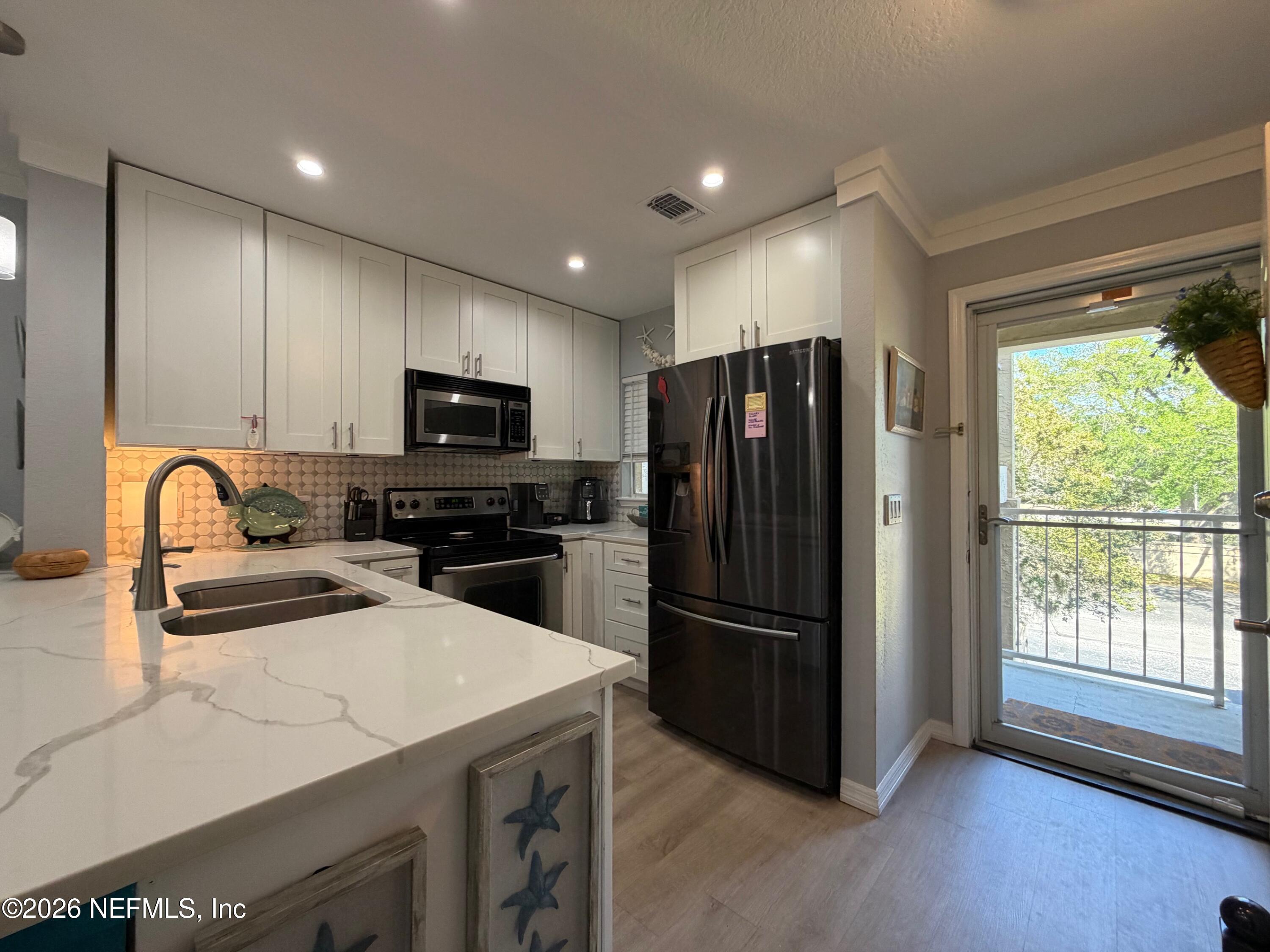 Image 2: Kitchen to Entry