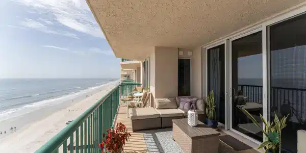 Image 3: unit balcony acroos bedrooms and living