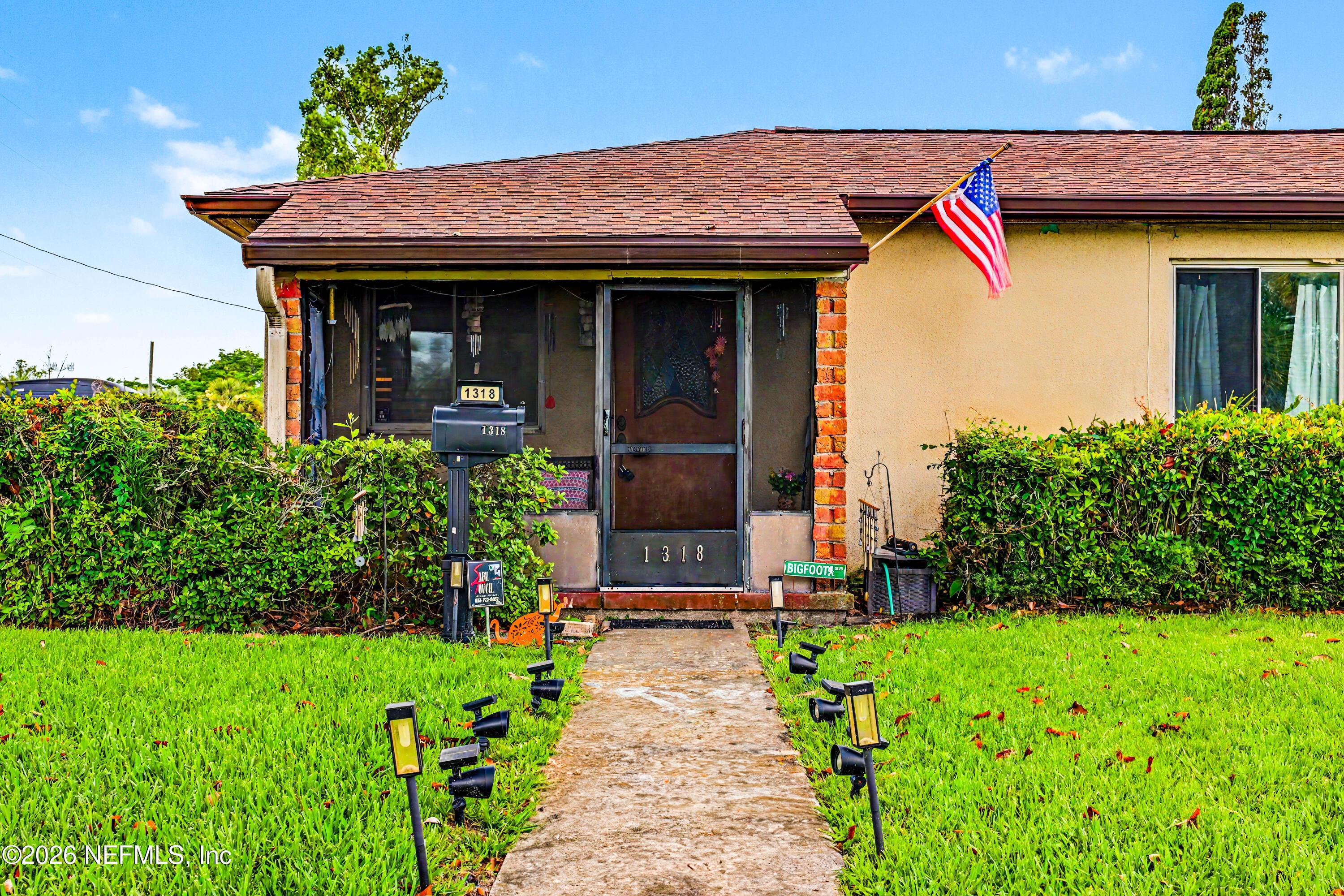 Image 2: Sidewalk/Front door