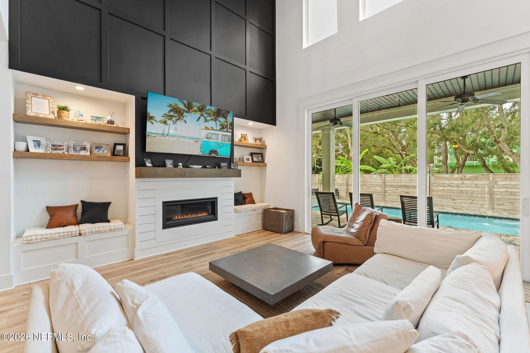 Image 1: Living room out to pool