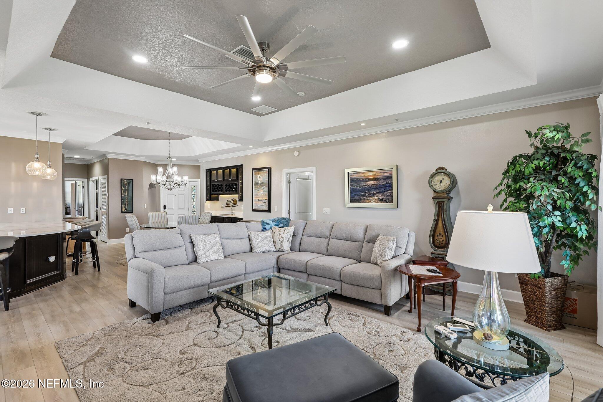 Image 4: Living Area to Dining and Foyer