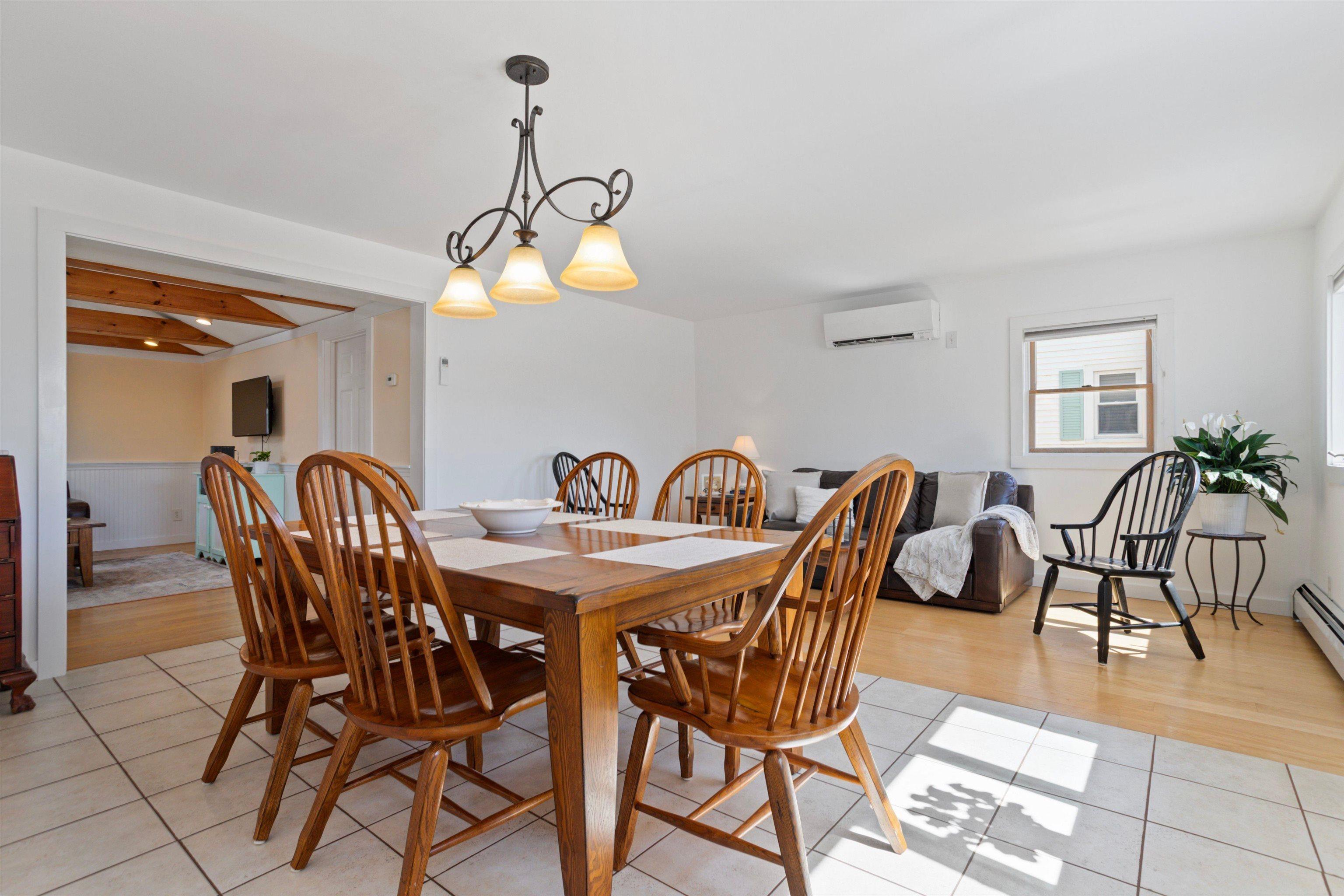 Image 4: An open concept dining and living room