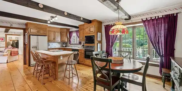 Image 3: Large eat-in kitchen with pegged wide pine floors and expose
