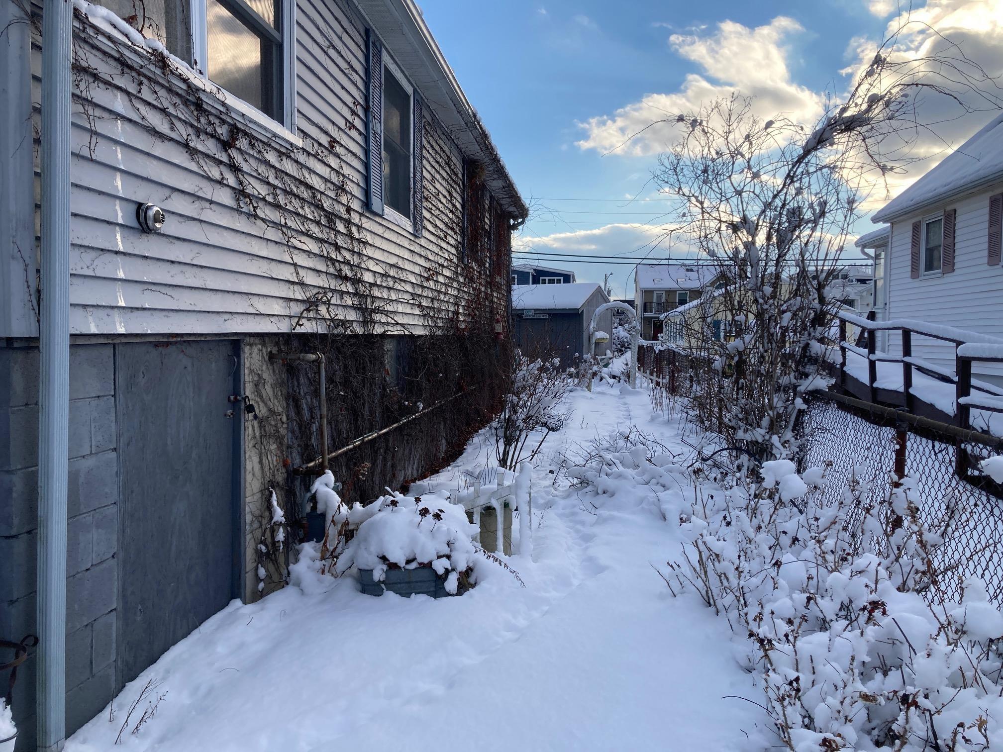 Image 4: West side walkway to rear yard