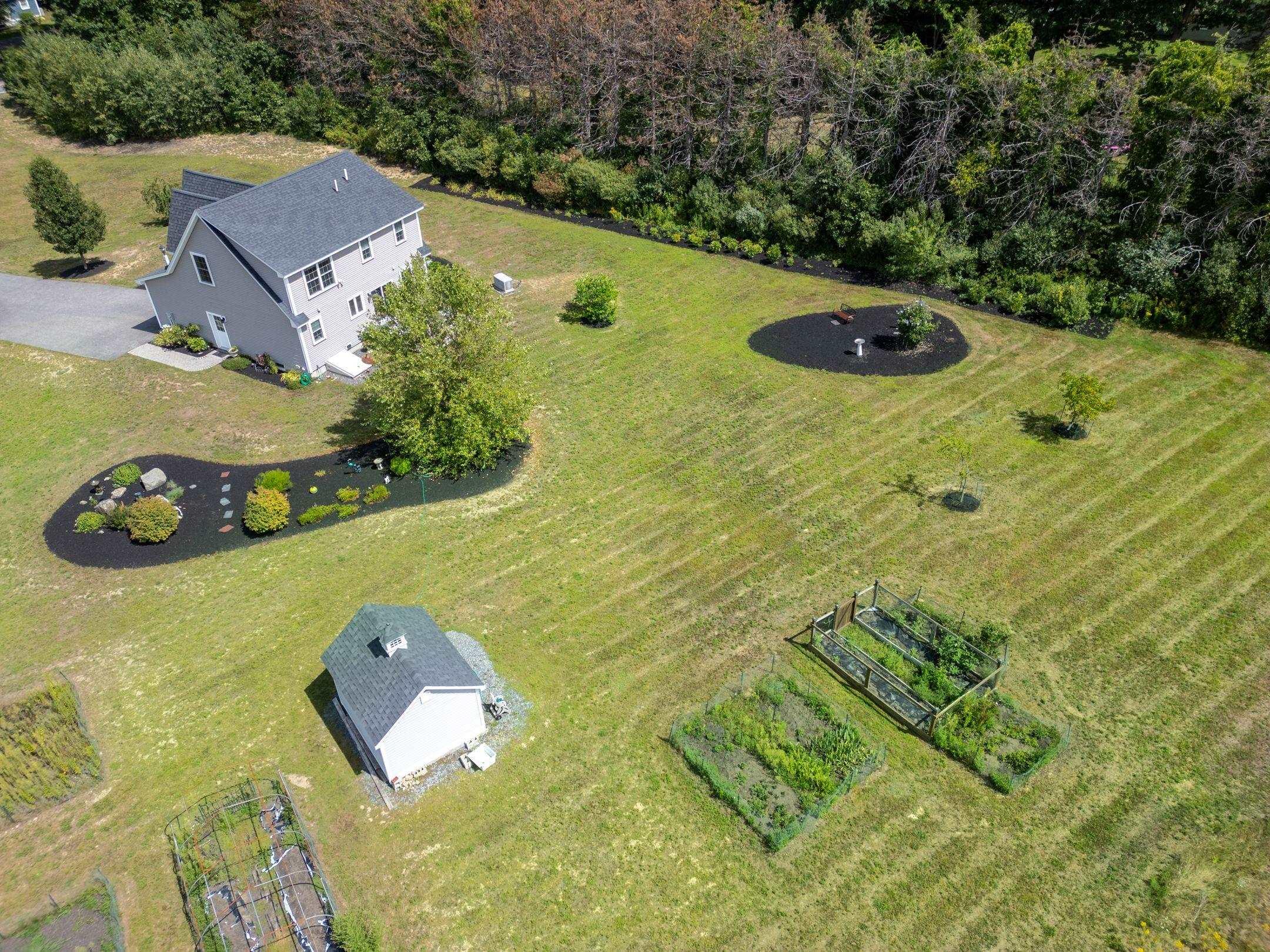 Image 2: View of backyard and Reeds Ferry Garden Shed