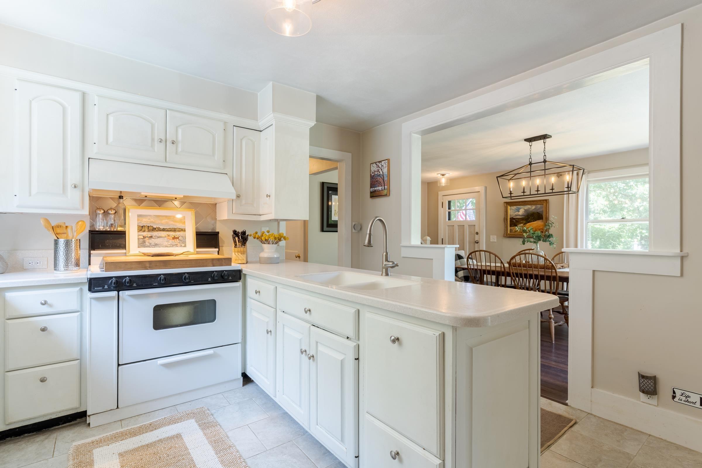 Image 3: Kitchen opens up to Dining Room