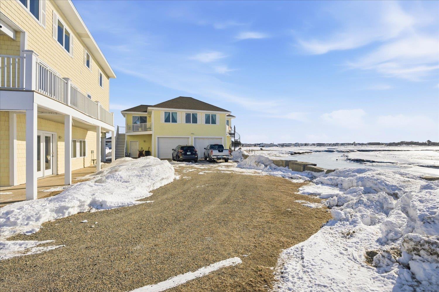 Image 4: Two residences positioned on a scenic waterfront lot.