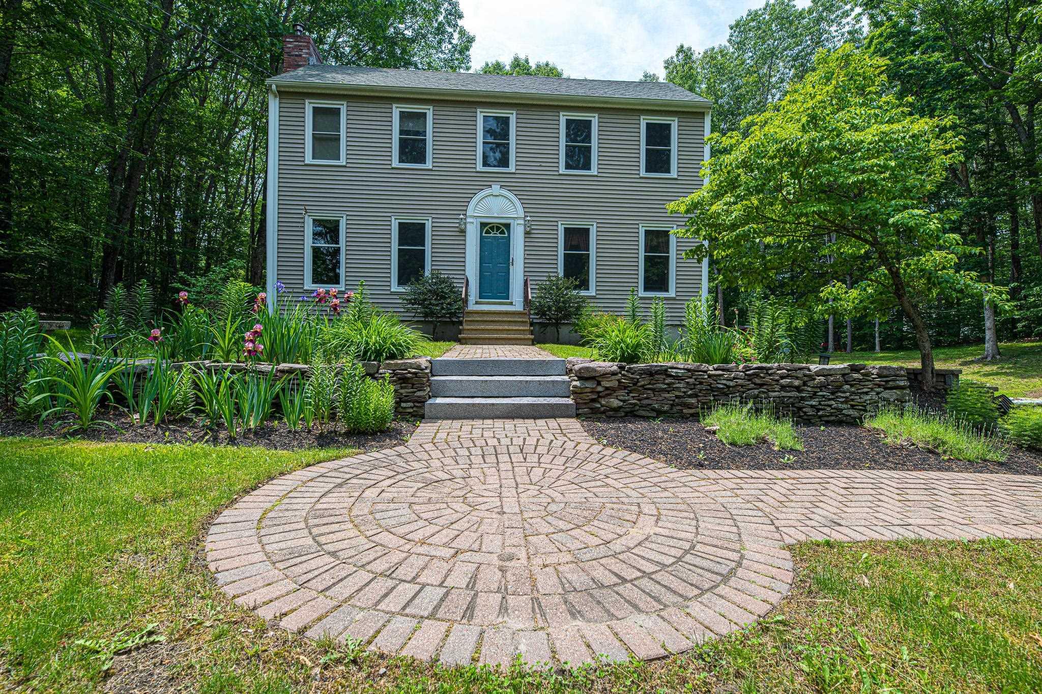 Image 2: Front entrance with brick pavers
