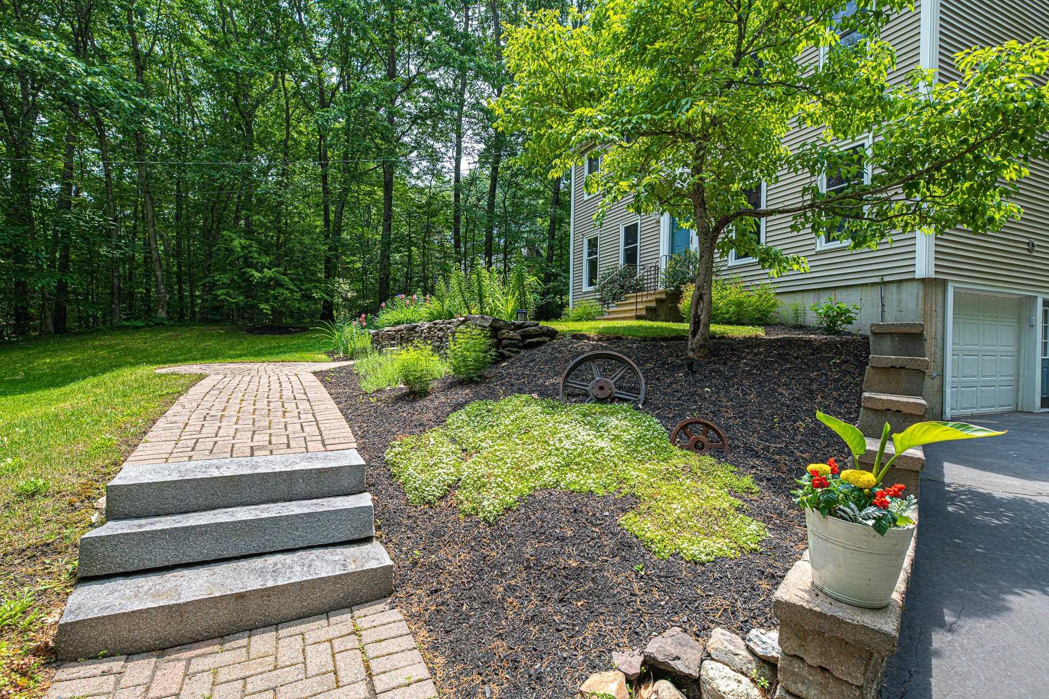 Image 3: Landscaped front walk way