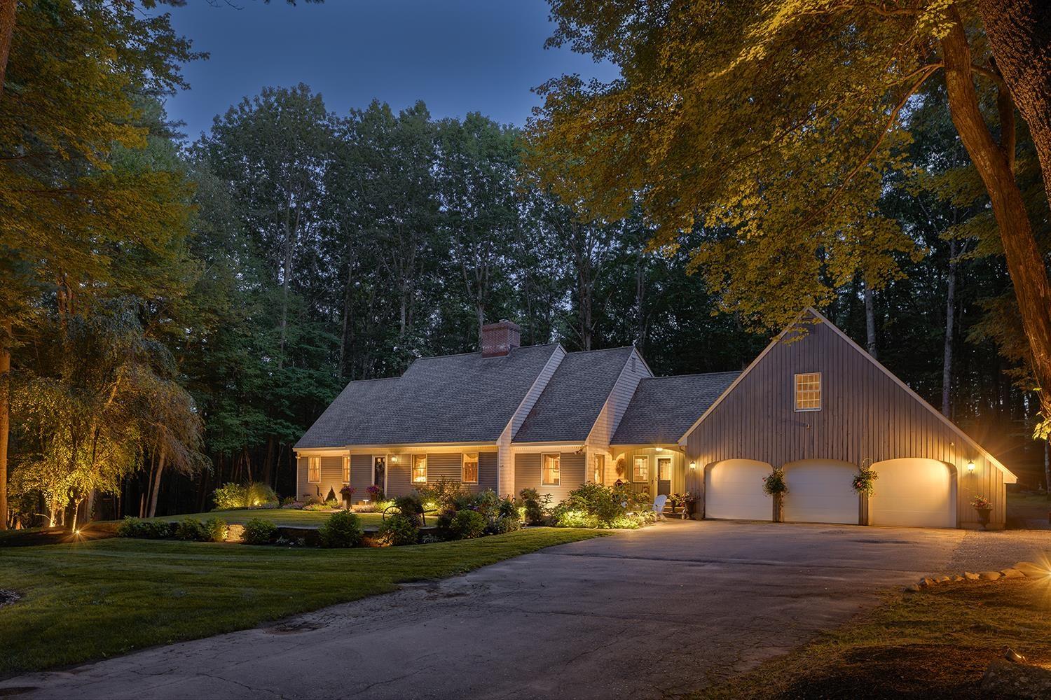 Image 0: Exterior Front Elevation at Twilight