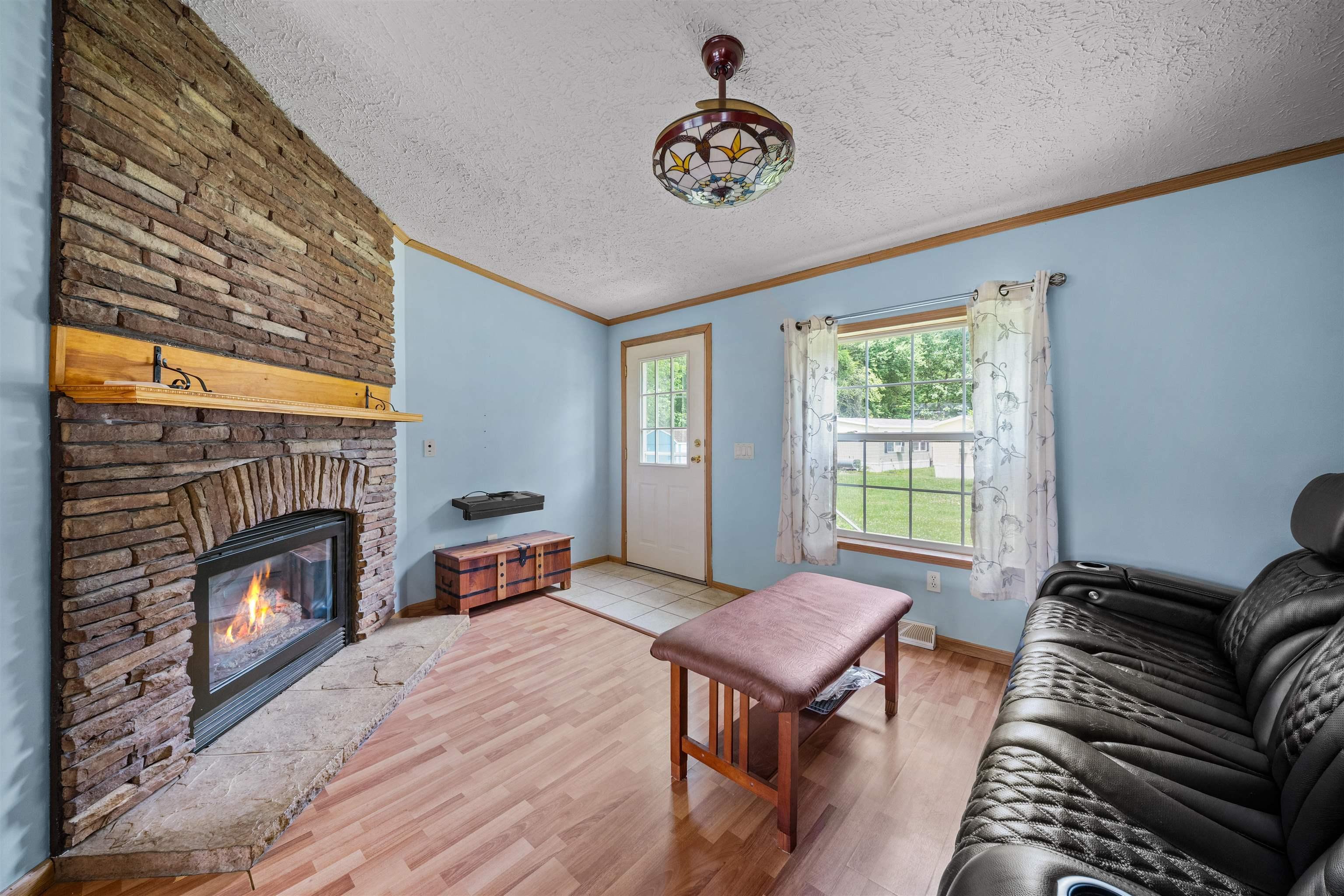 Image 4: Open Living Room into Dining Room and Kitchen