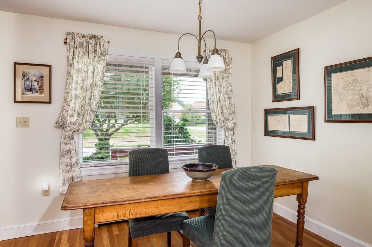 Image 3: Eat-in area with a bay window overlooking front porch