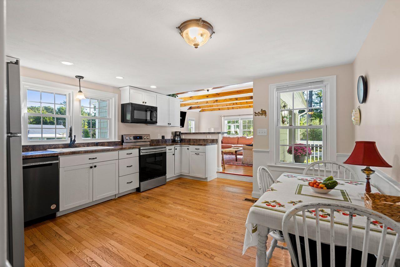 Image 2: Eat In Kitchen opens to Family Room