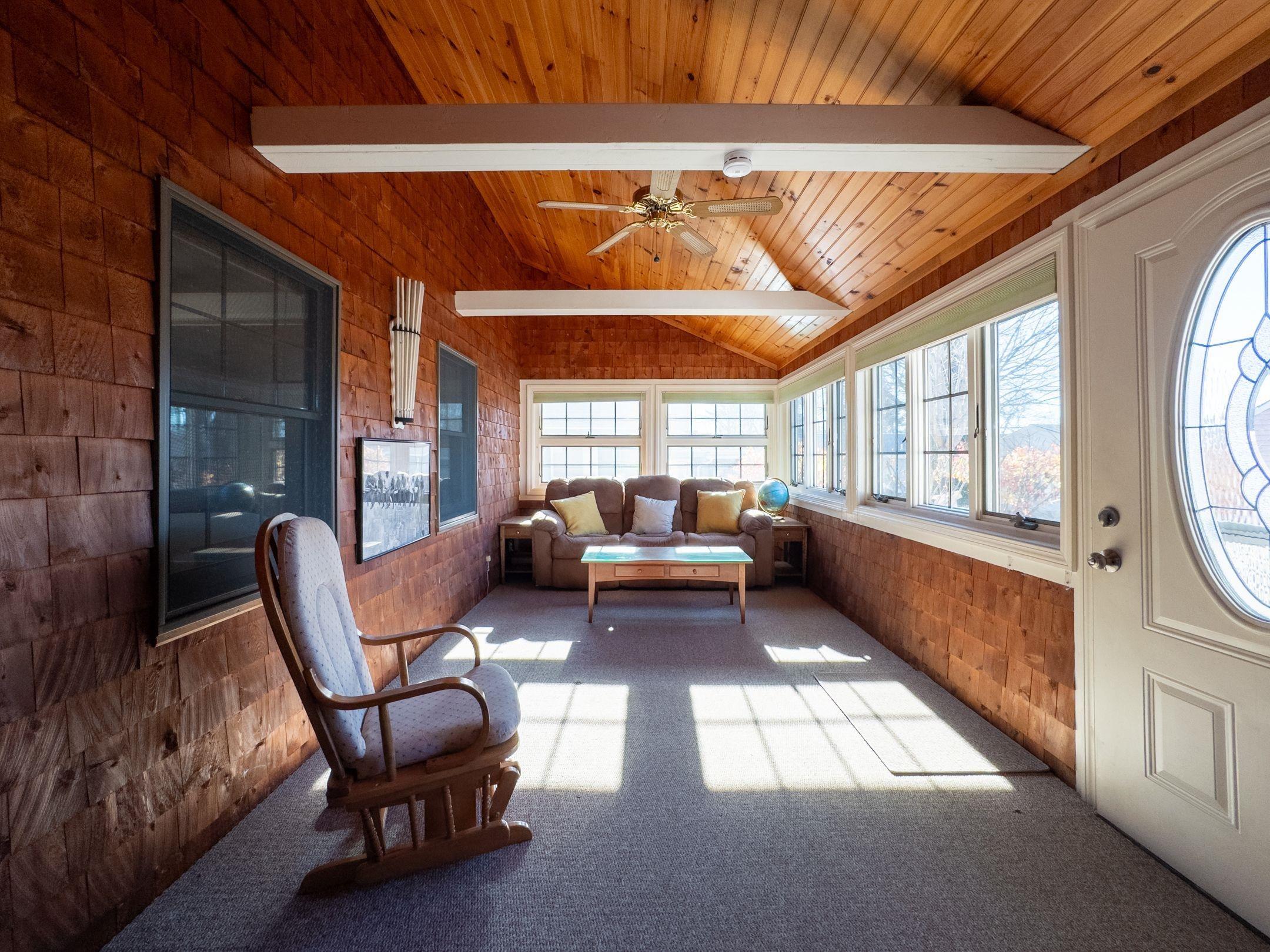 Image 3: Living room with vaulted ceiling