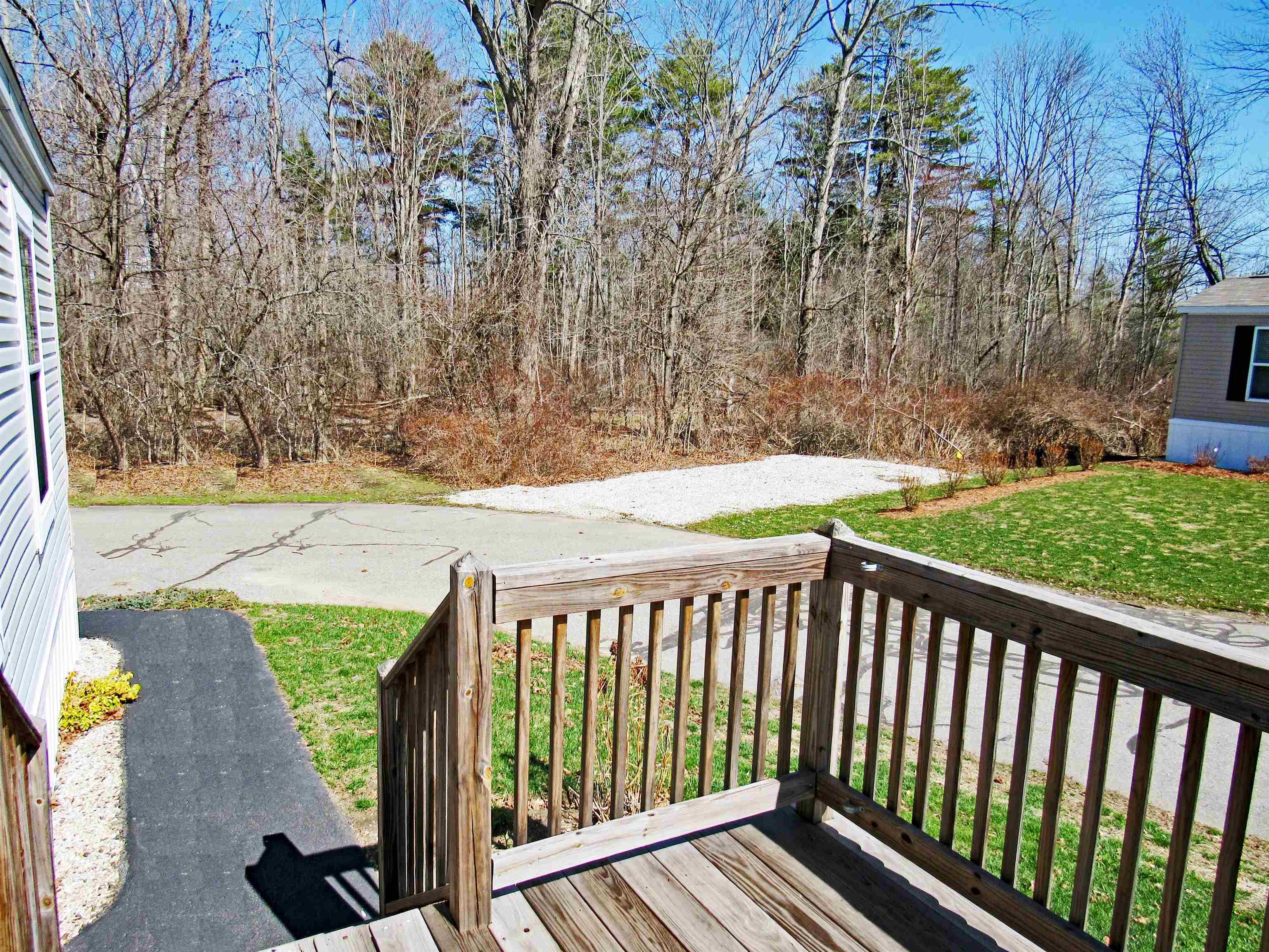Image 3: Relaxing deck overlooking wooded area and stream Image 3: Relaxing deck overlooking wooded area and stream