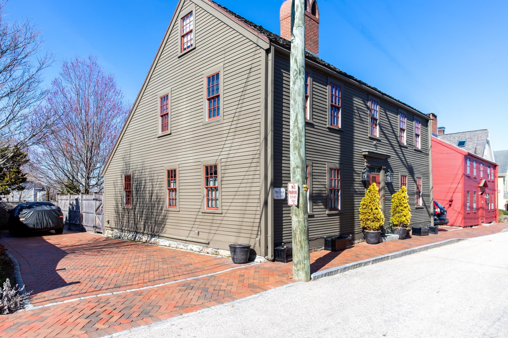 Image 3: Exterior Side Elevation Showing Brick Parking Area
