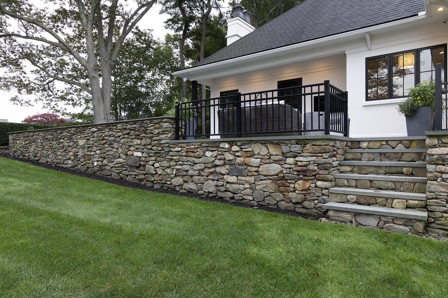Image 3: Local Stone Retaining Walls with Stairs to Yard