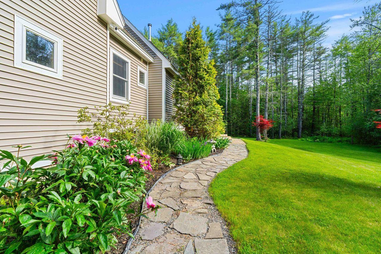 Image 2: Beautiful Walkway to Front of Home