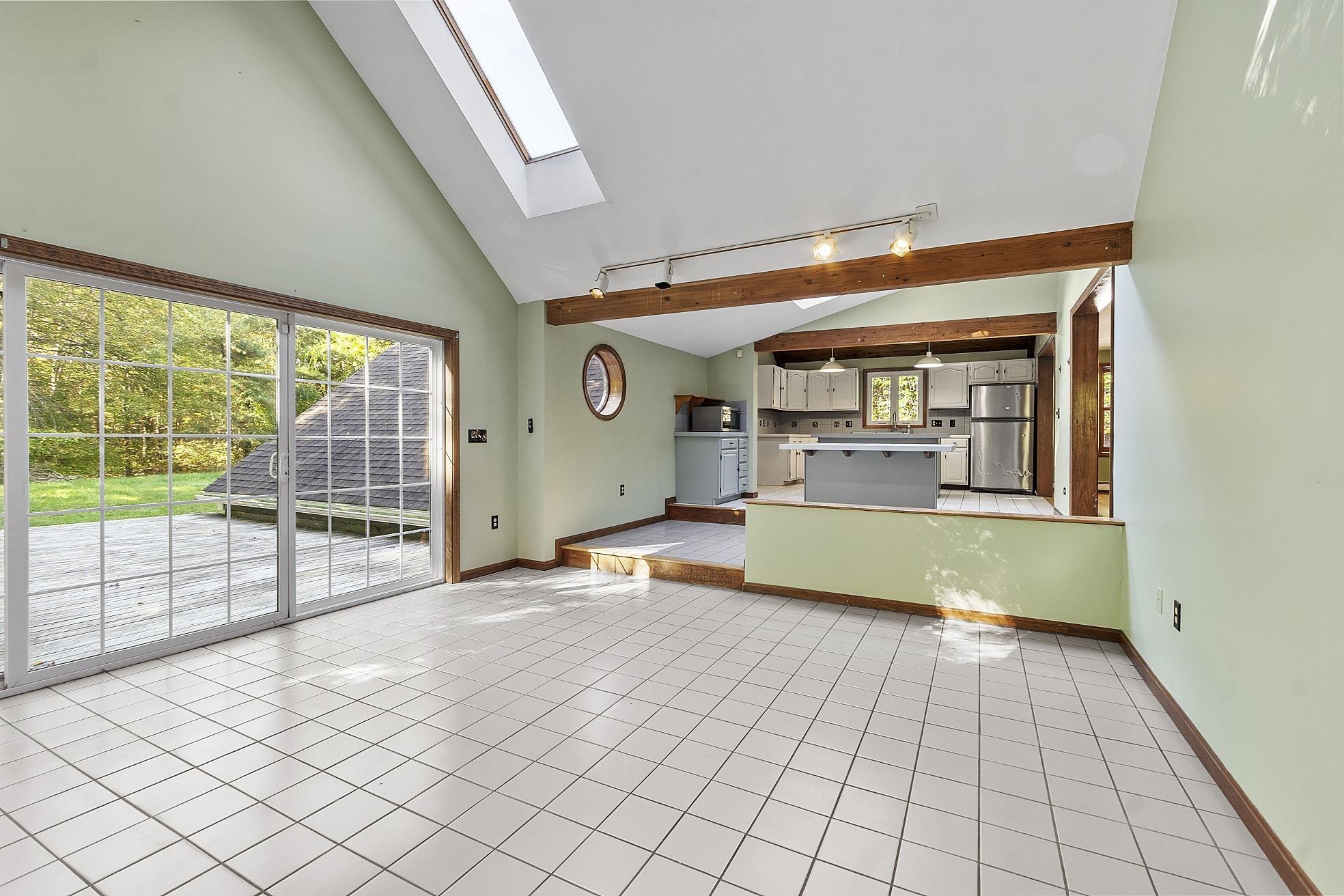 Image 4: Sunroom and Kitchen