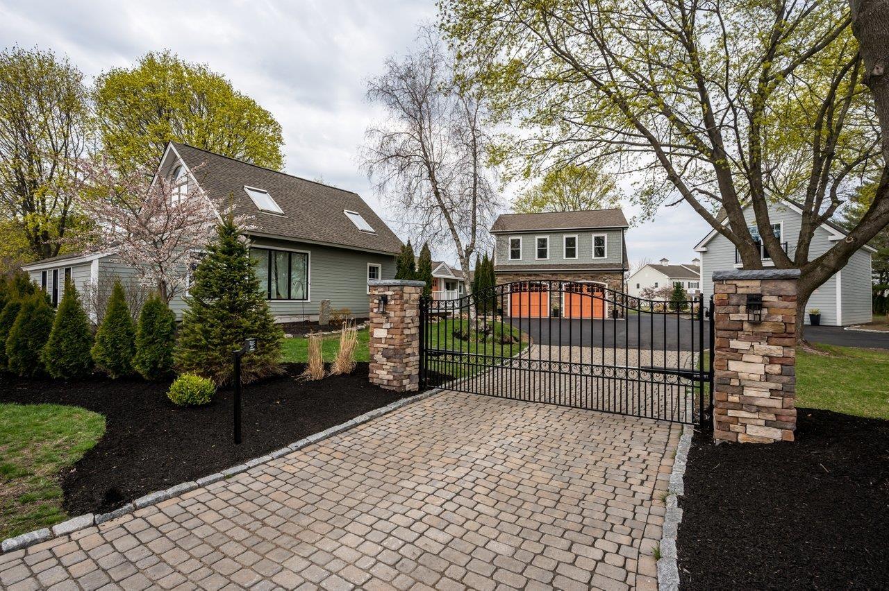 Image 0: Electronically controlled Gates with keypad and remote controls for security and preventing turn arounds by passing vehicles., Main Gated Entrance from the Street