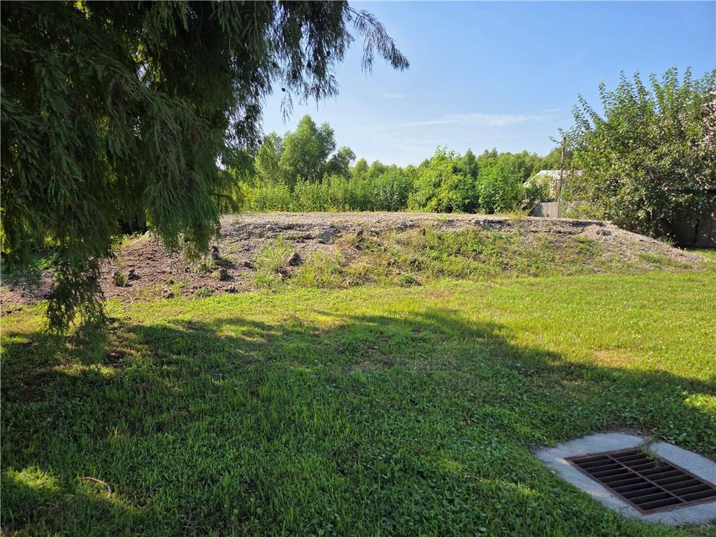 Image 2: angle from front near beautiful oak tree