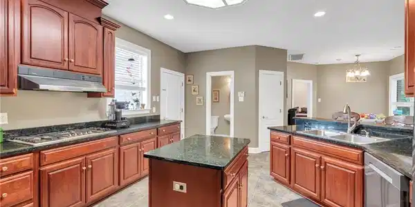Image 3: Open kitchen with island in the middle, double sin