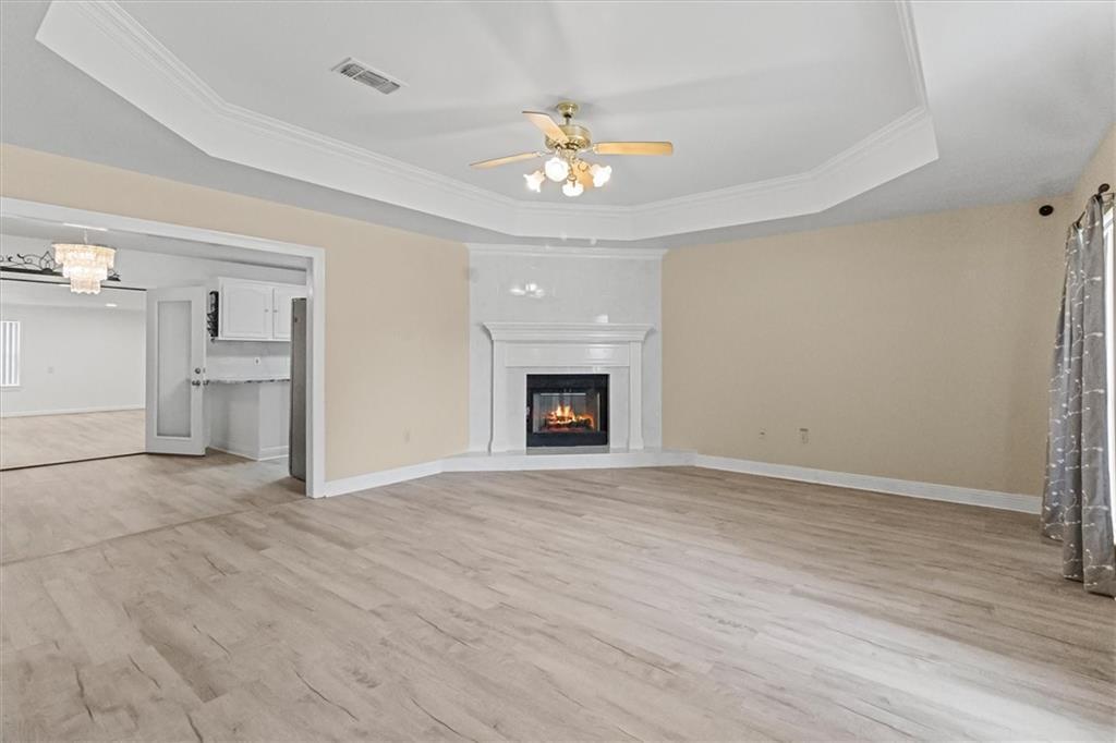 Image 3: formal living with fireplace
