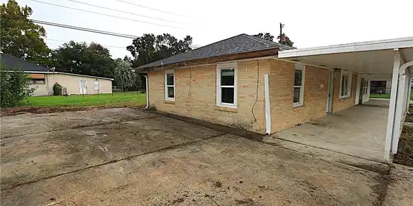 Image 3: Left side with parking pad