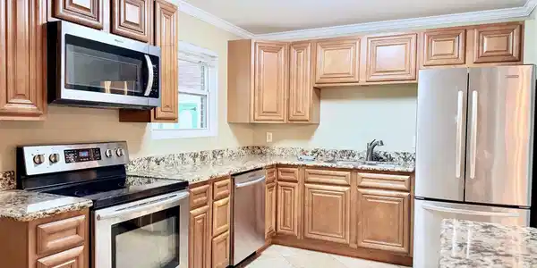 Image 2: Stainless appliances and granite countertops