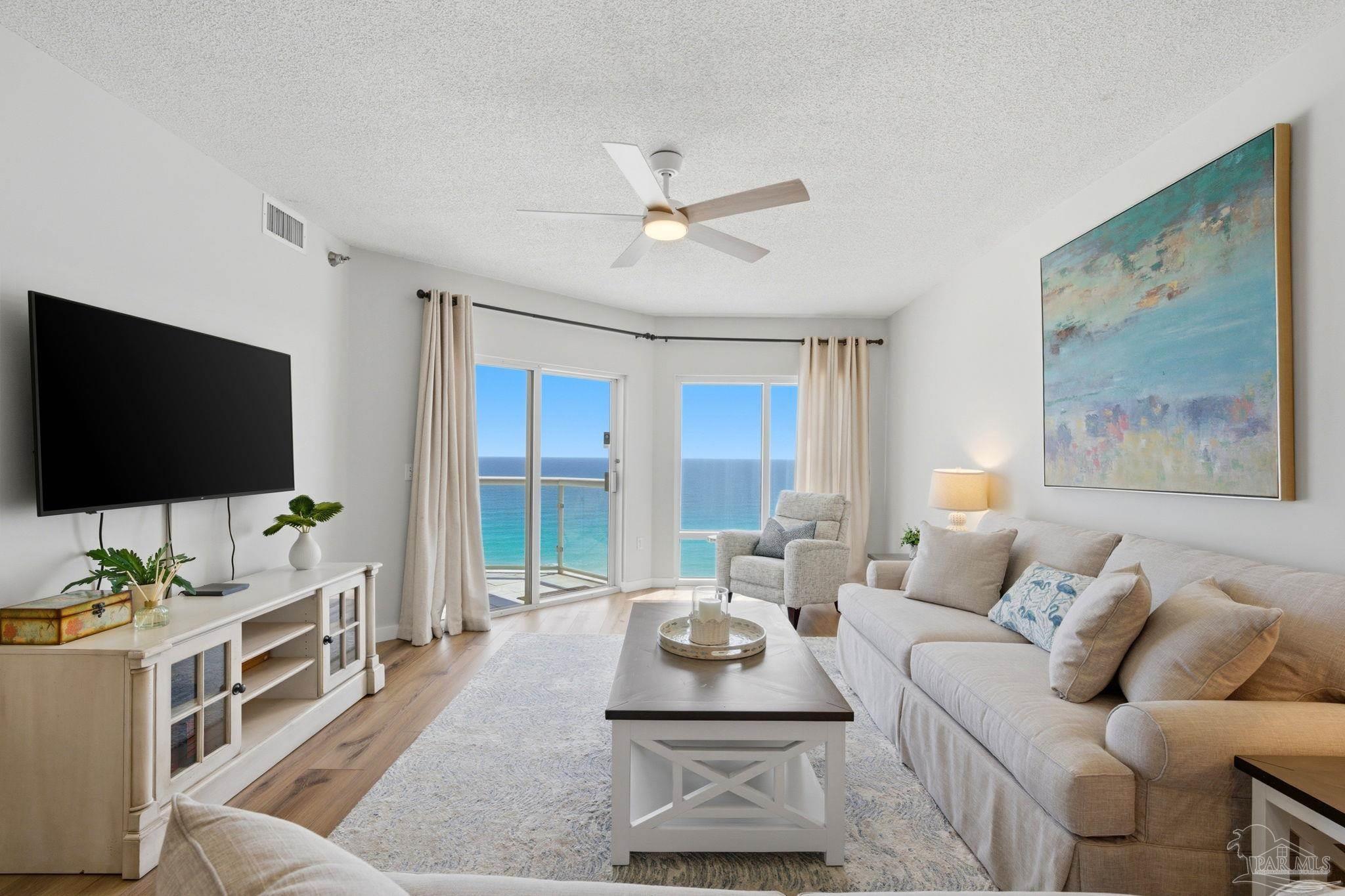 Image 4: Bright, open living with balcony access