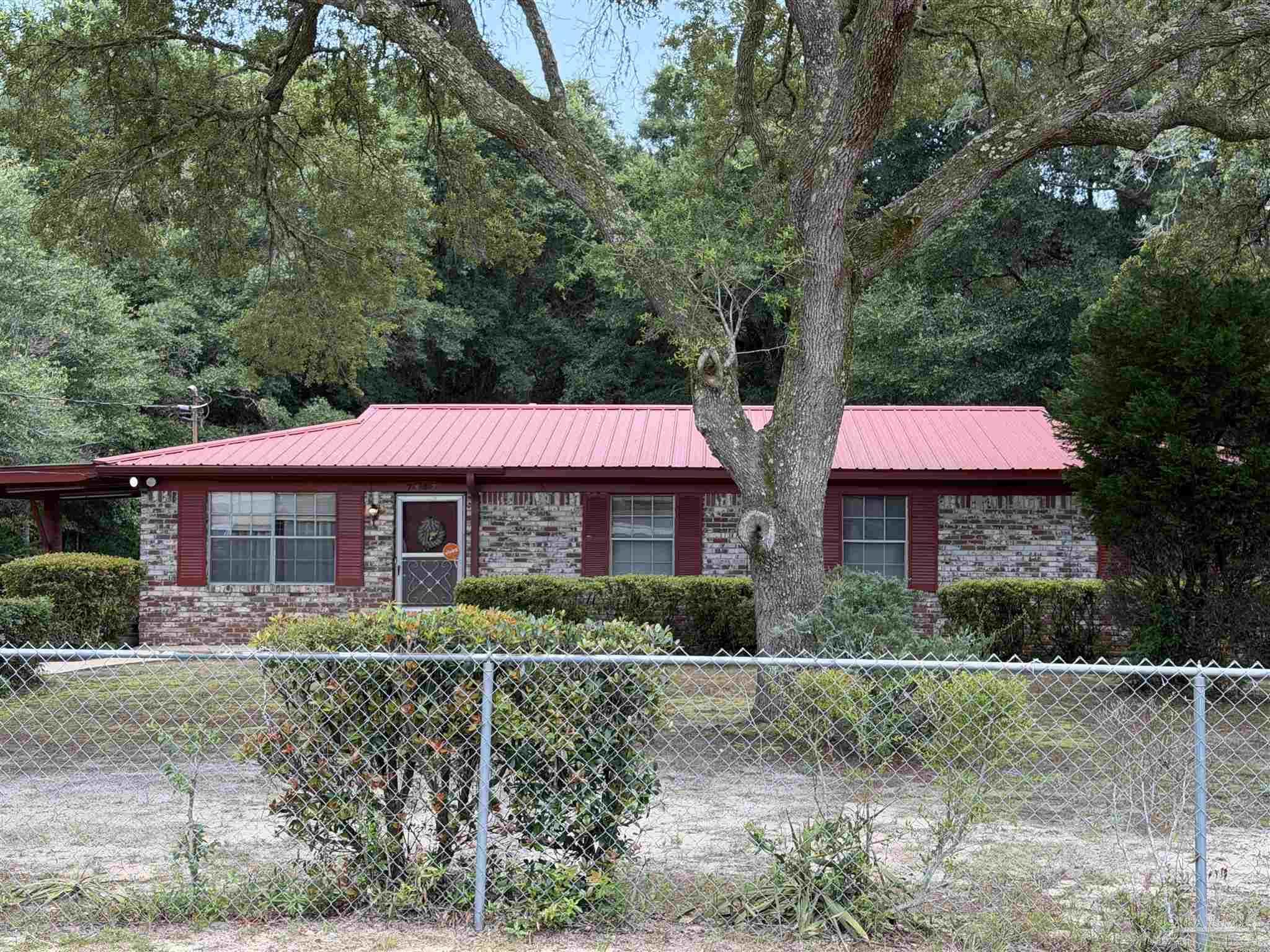 Image 3: Front from outside of fence.