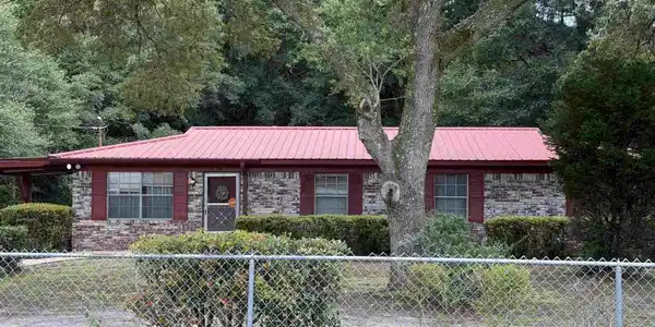 Image 3: Front from outside of fence.