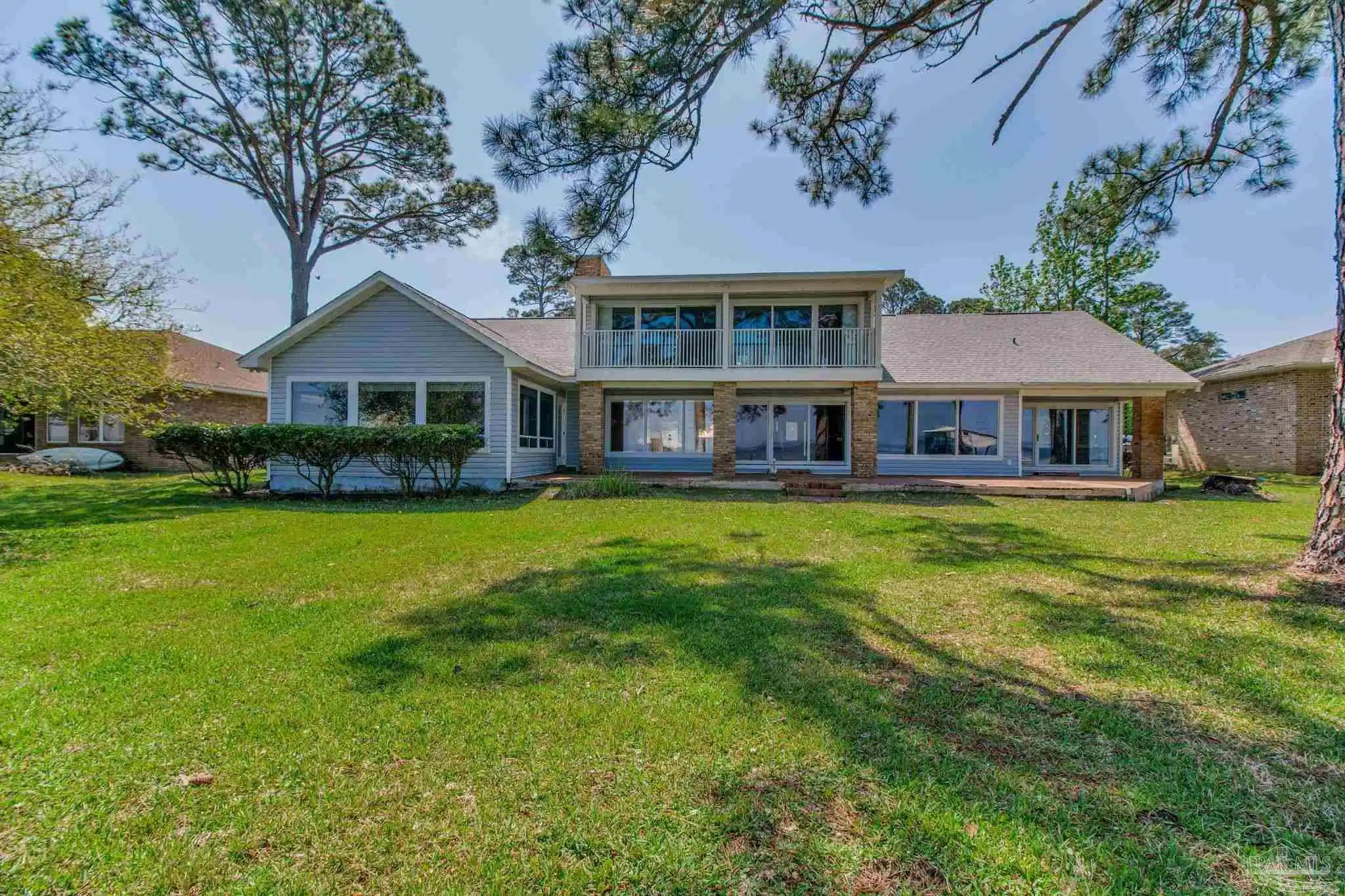 Image 1: View of house from the water