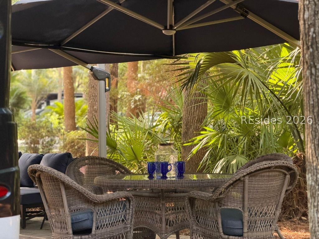 Image 4: Dinning table w/ 4 chairs under 2nd large umbrella