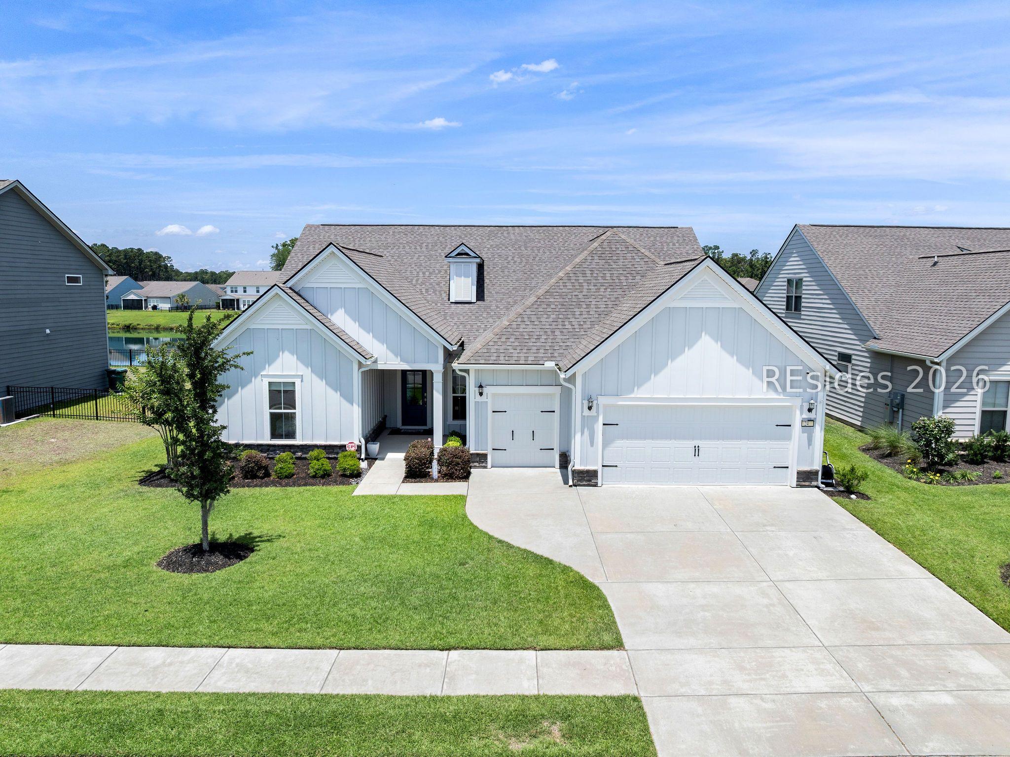 Image 1: 24 Ahoy Bluffton SC craftsman home with lake
