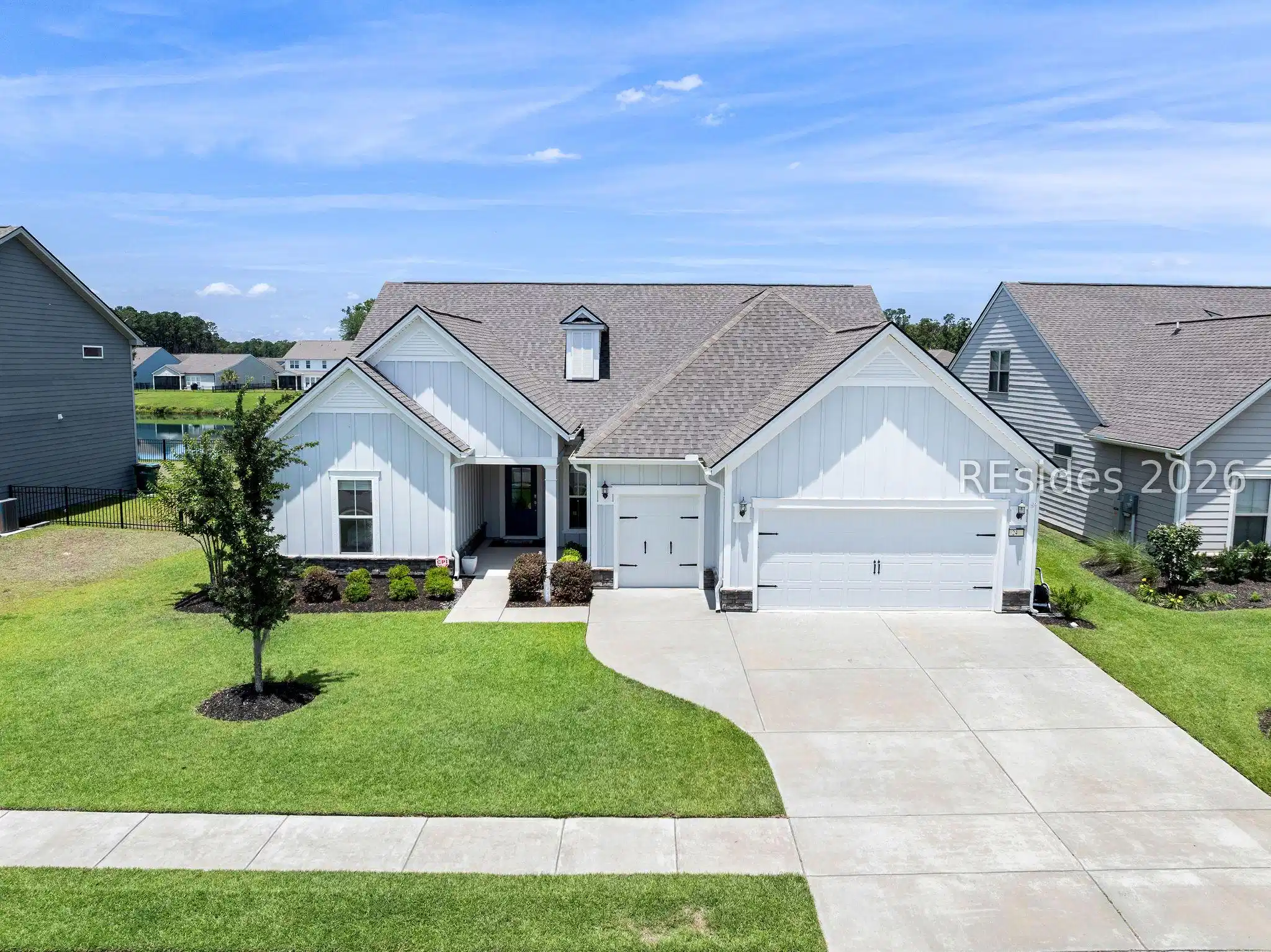 Image 1: 24 Ahoy Bluffton SC craftsman home with lake