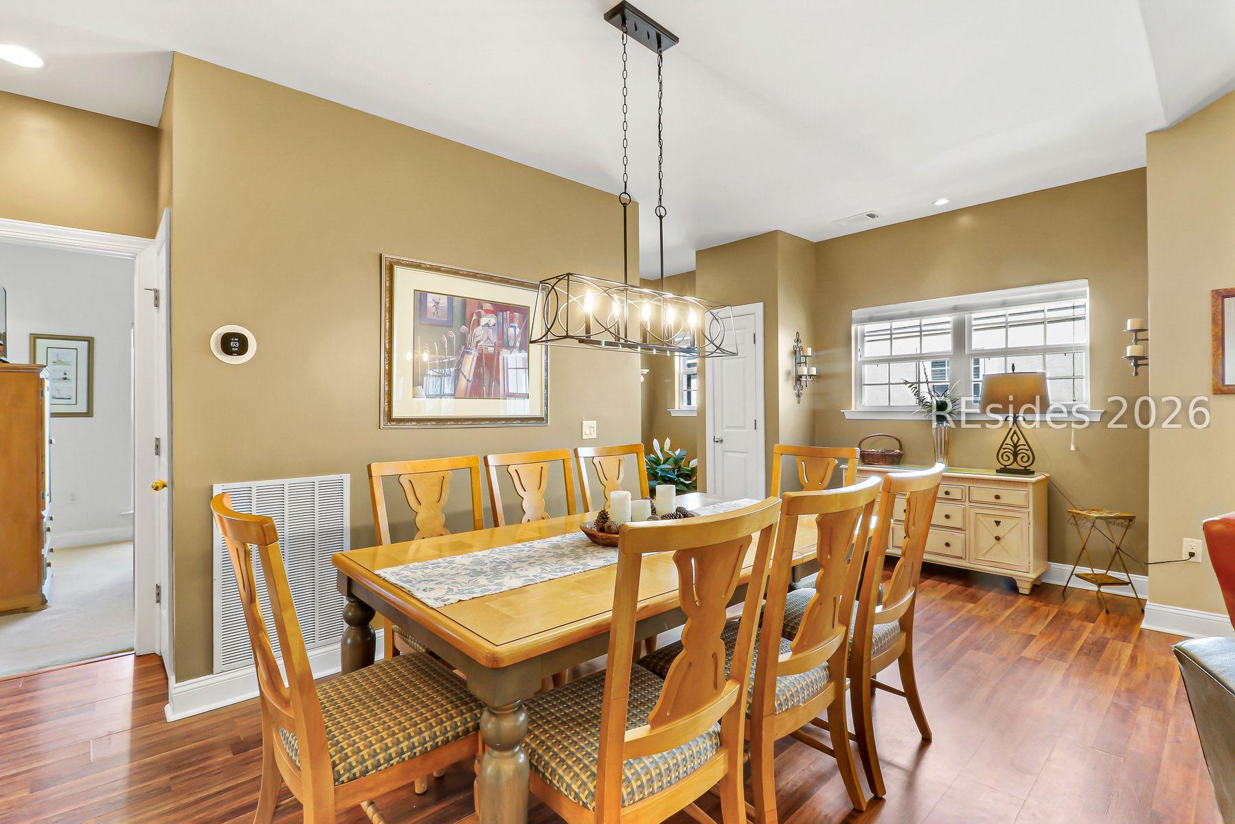 Image 2: Villa entrance flows into sunny, open dining area.