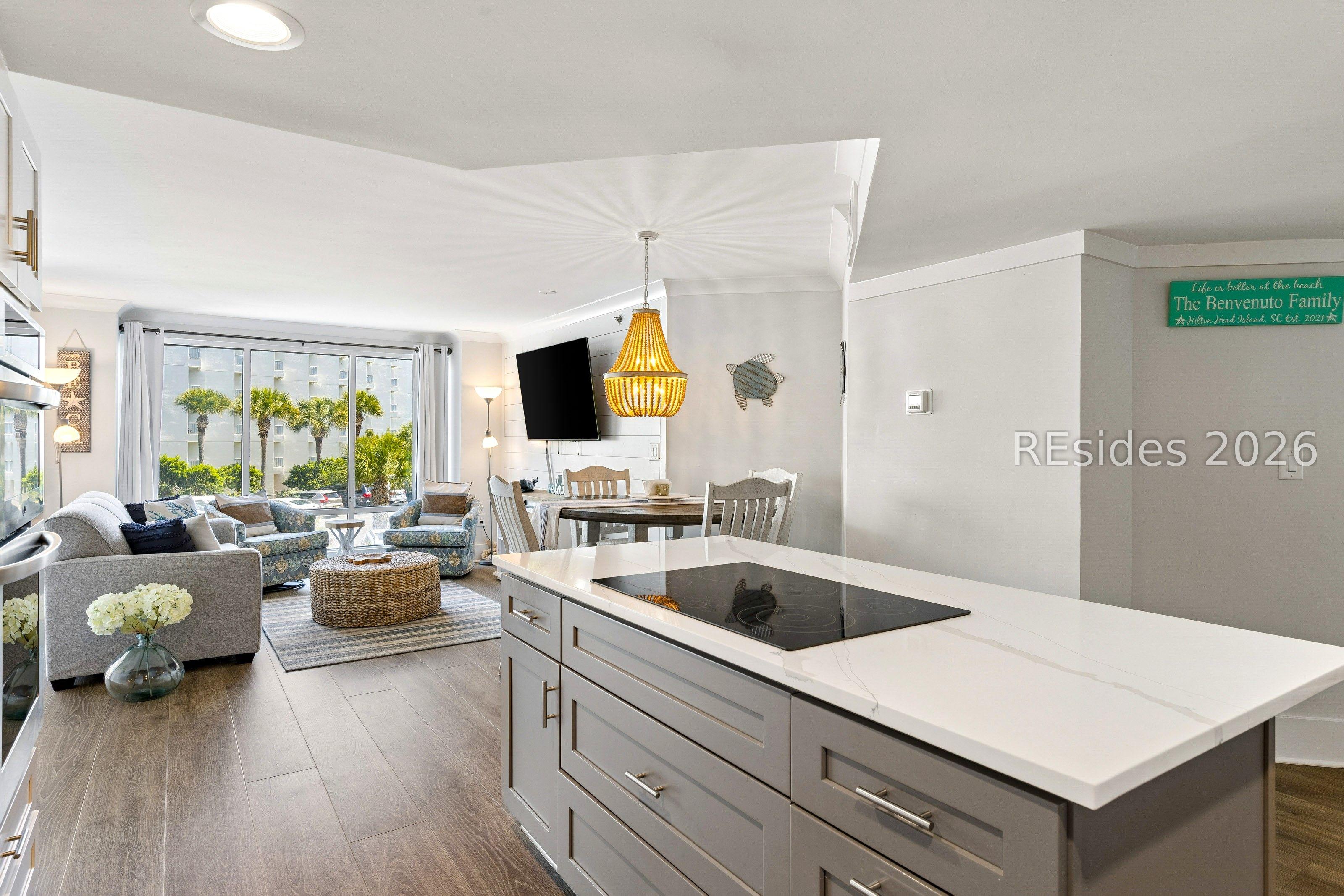 Image 3: Kitchen open to dining and living room w/oceanview