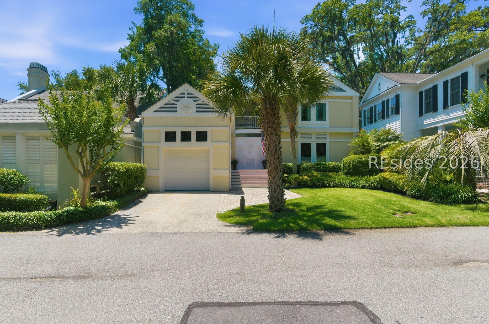 Image 1: Front of home with Charleston style entry
