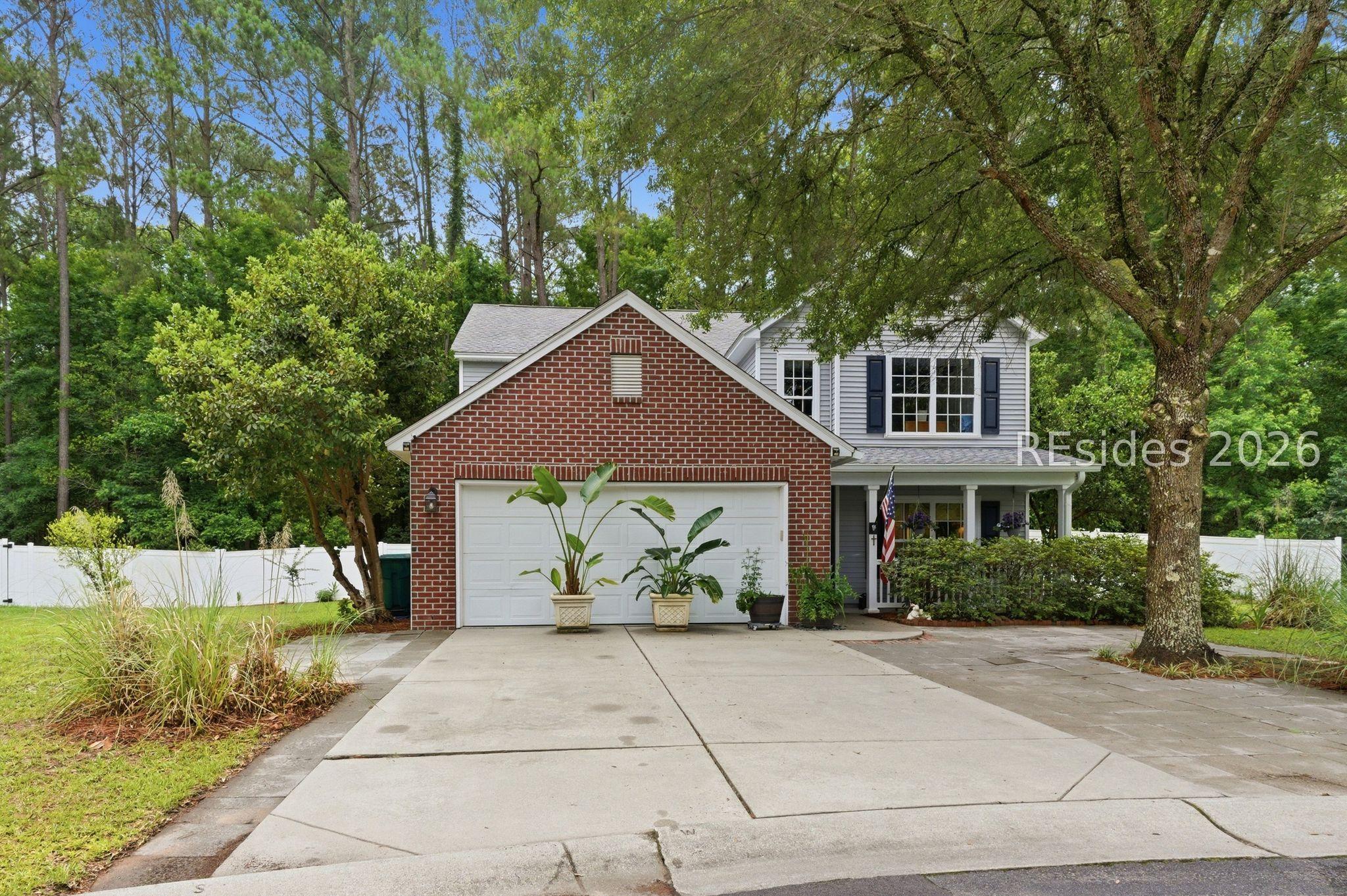 Image 4: Two car garage with extended driveway. Image 4: Two car garage with extended driveway.