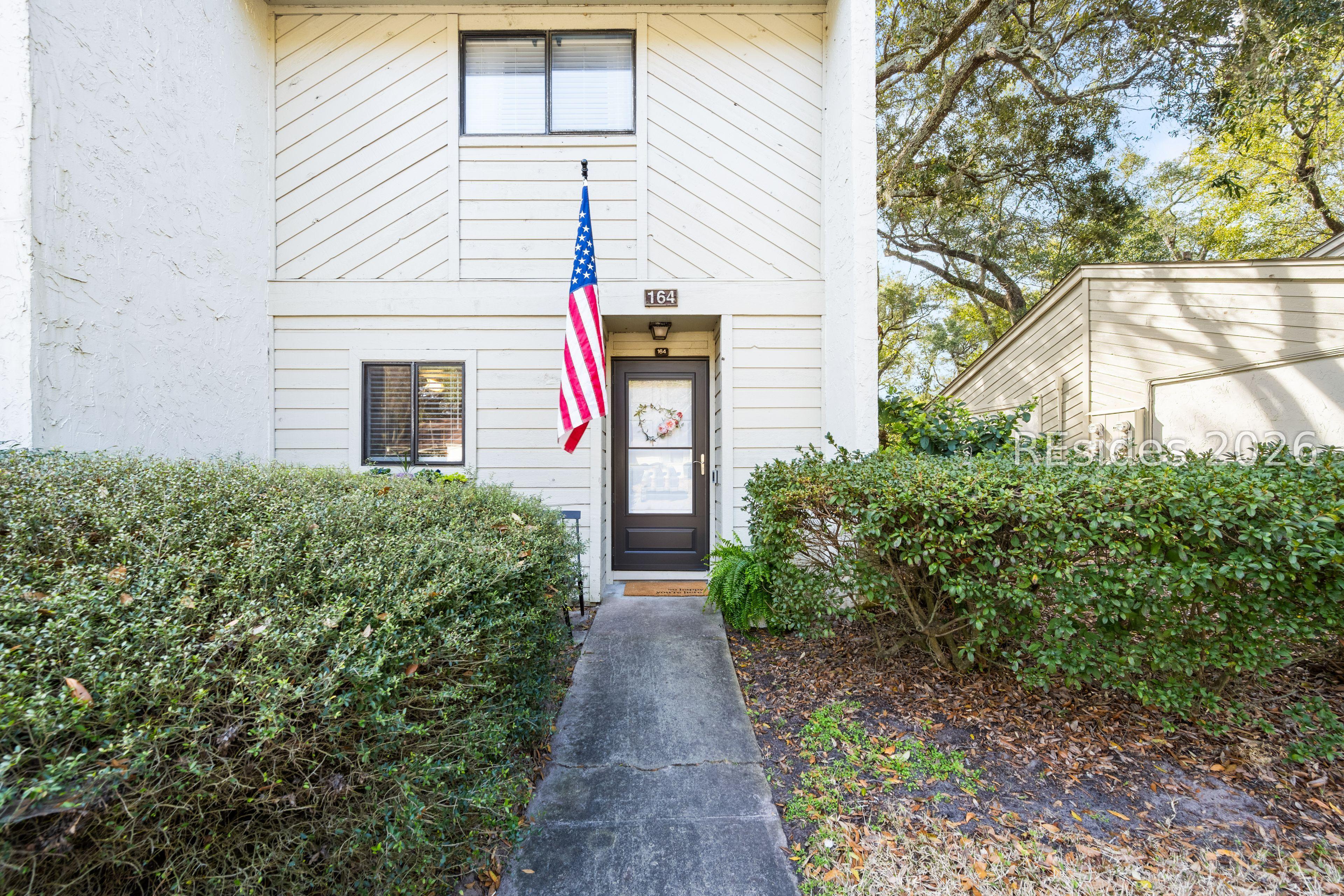 Image 3: Walkway into unit #164