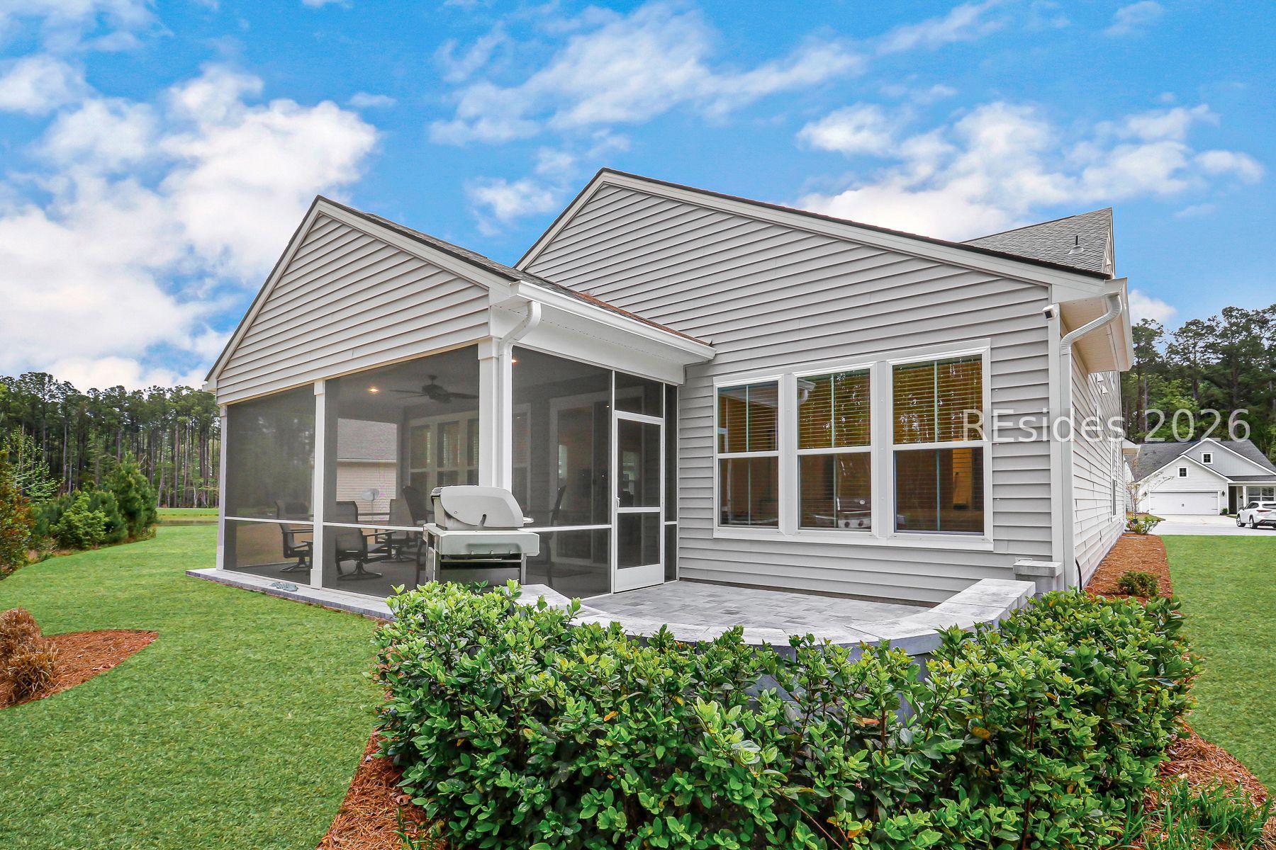 Image 4: View of Screened-in Porch & Paver Patio