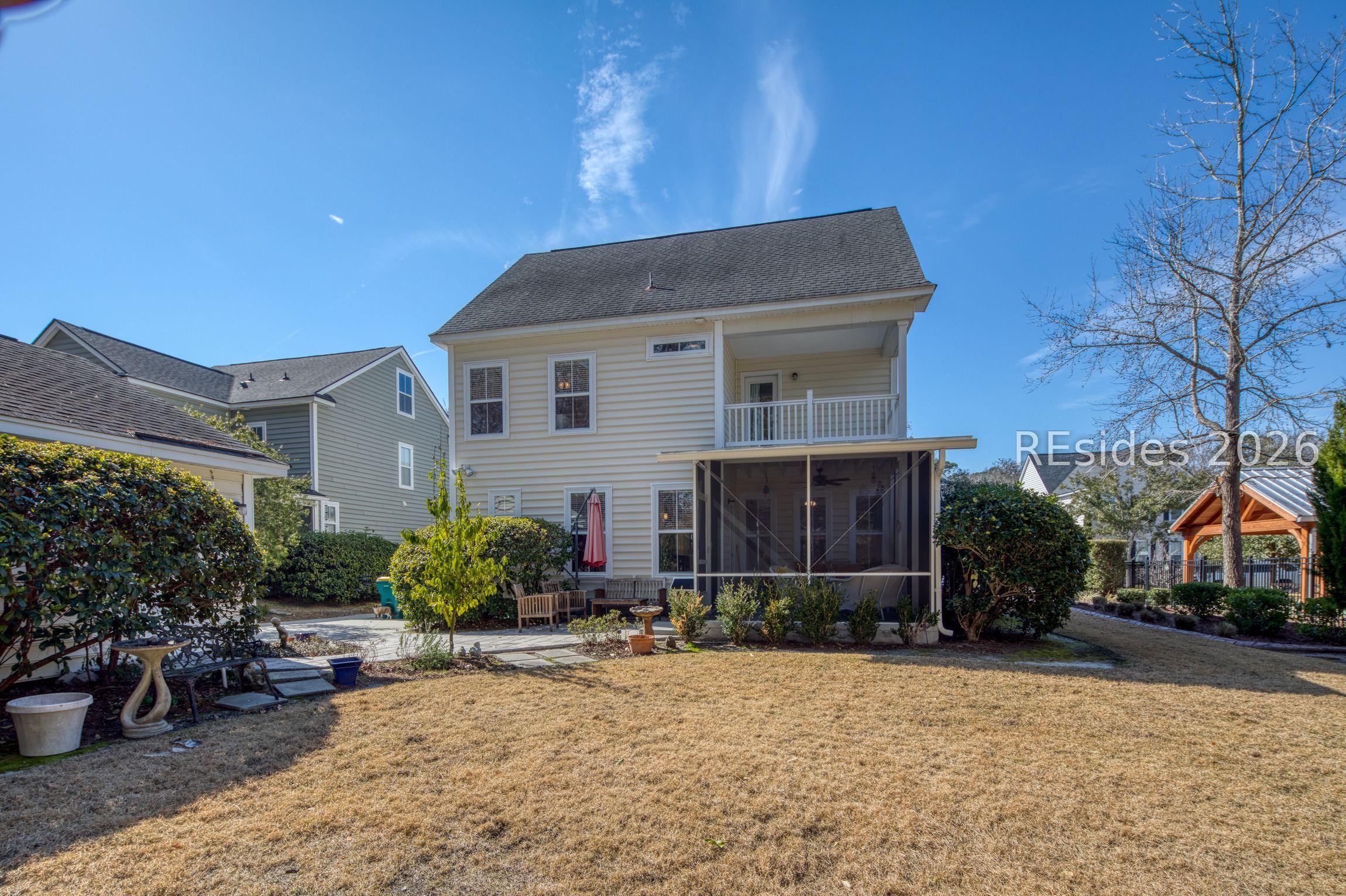 Image 3: Rear yard and extended screened porch