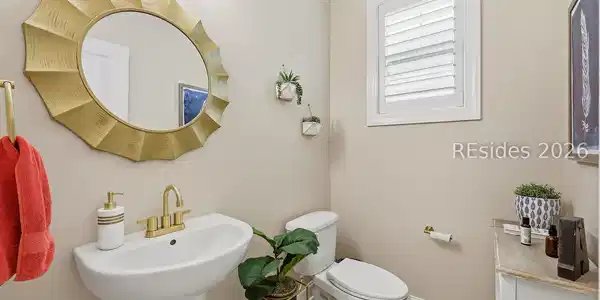Image 4: Half bath tucked away on main level Image 4: Half bath tucked away on main level